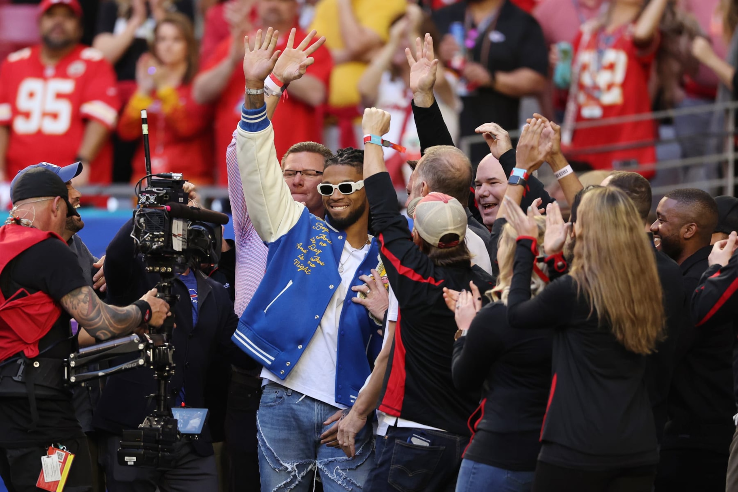 GLENDALE, ARIZONA - FEBRUARY 12: Damar Hamlin of the Buffalo Bill stands with the medical personnel that cared for him after he collapsed during a game on January 2, 2023 before Super Bowl LVII at State Farm Stadium on February 12, 2023 in Glendale, Arizona. (Photo by Gregory Shamus/Getty Images)