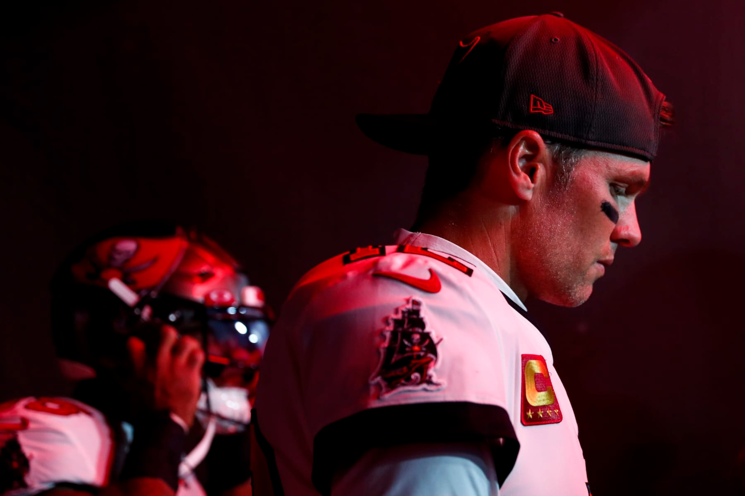TAMPA, FL - JANUARY 16: Tom Brady #12 of the Tampa Bay Buccaneers walks through the tunnel prior to an NFL wild card playoff football game against the Dallas Cowboys at Raymond James Stadium on January 16, 2023 in Tampa, Florida. (Photo by Kevin Sabitus/Getty Images)