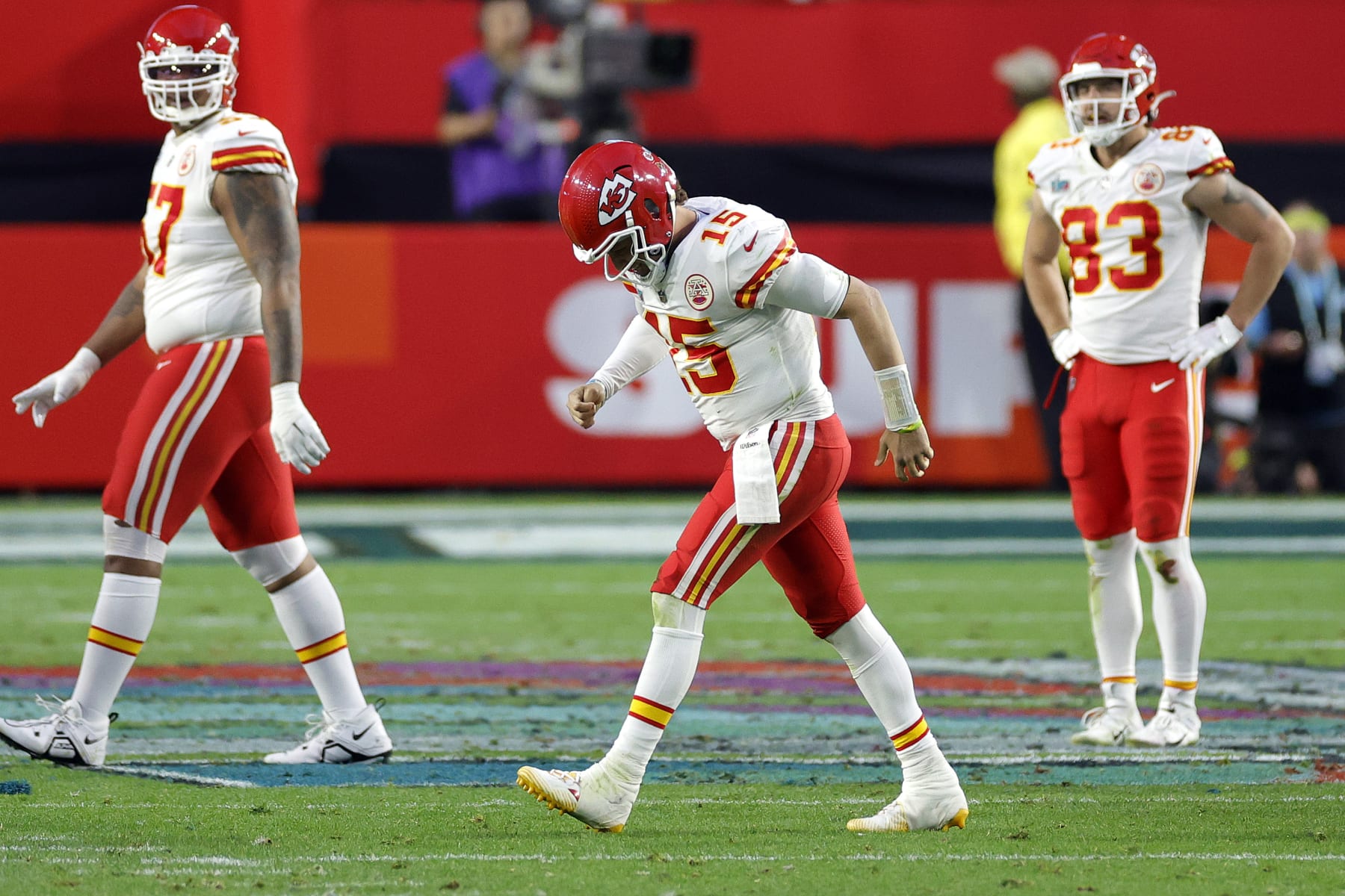 Patrick Mahomes (middle) of the Kansas City Chiefs limps off the field after injury during the second quarter against the Philadelphia Eagles in Super Bowl LVII at State Farm Stadium on February 12 in Glendale, Arizona. 