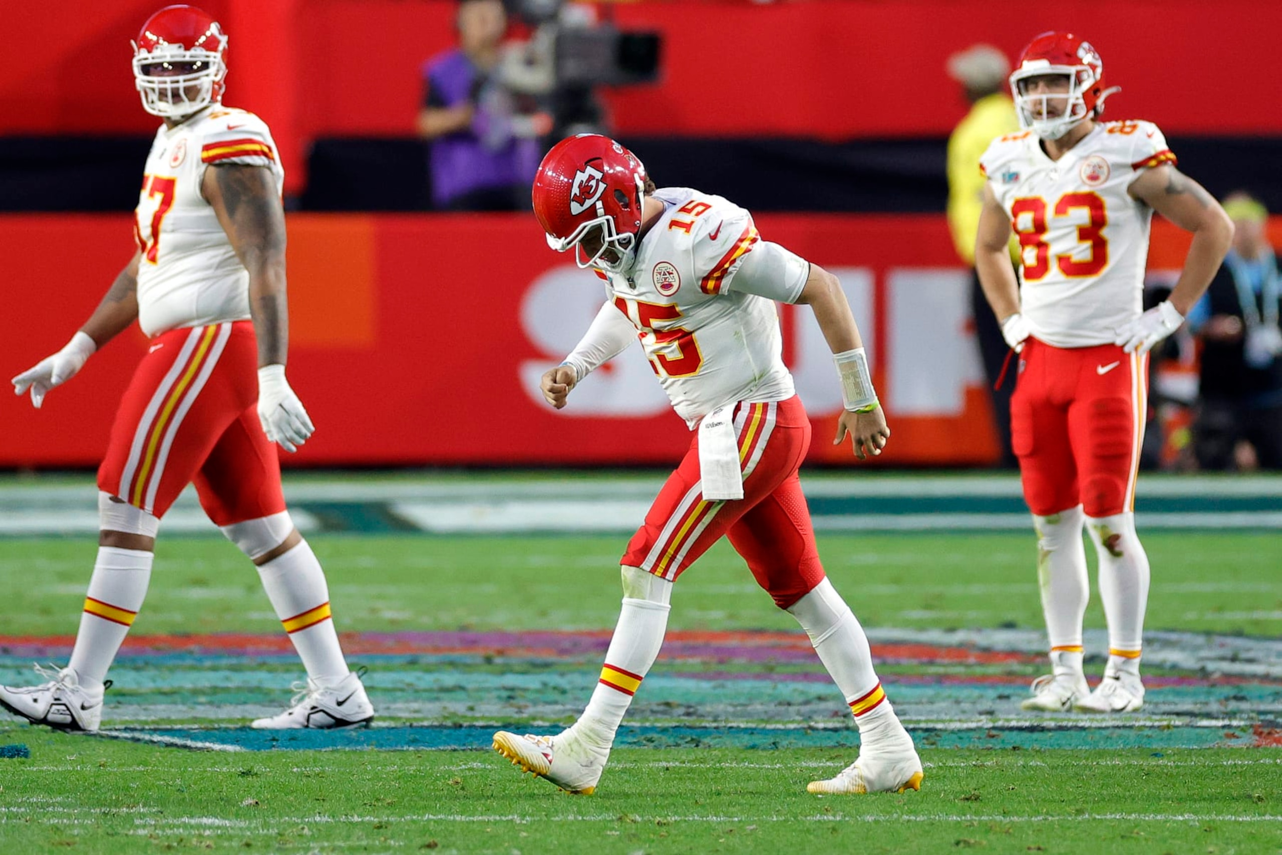 Patrick Mahomes (middle) of the Kansas City Chiefs limps off the field after injury during the second quarter against the Philadelphia Eagles in Super Bowl LVII at State Farm Stadium on February 12 in Glendale, Arizona. 