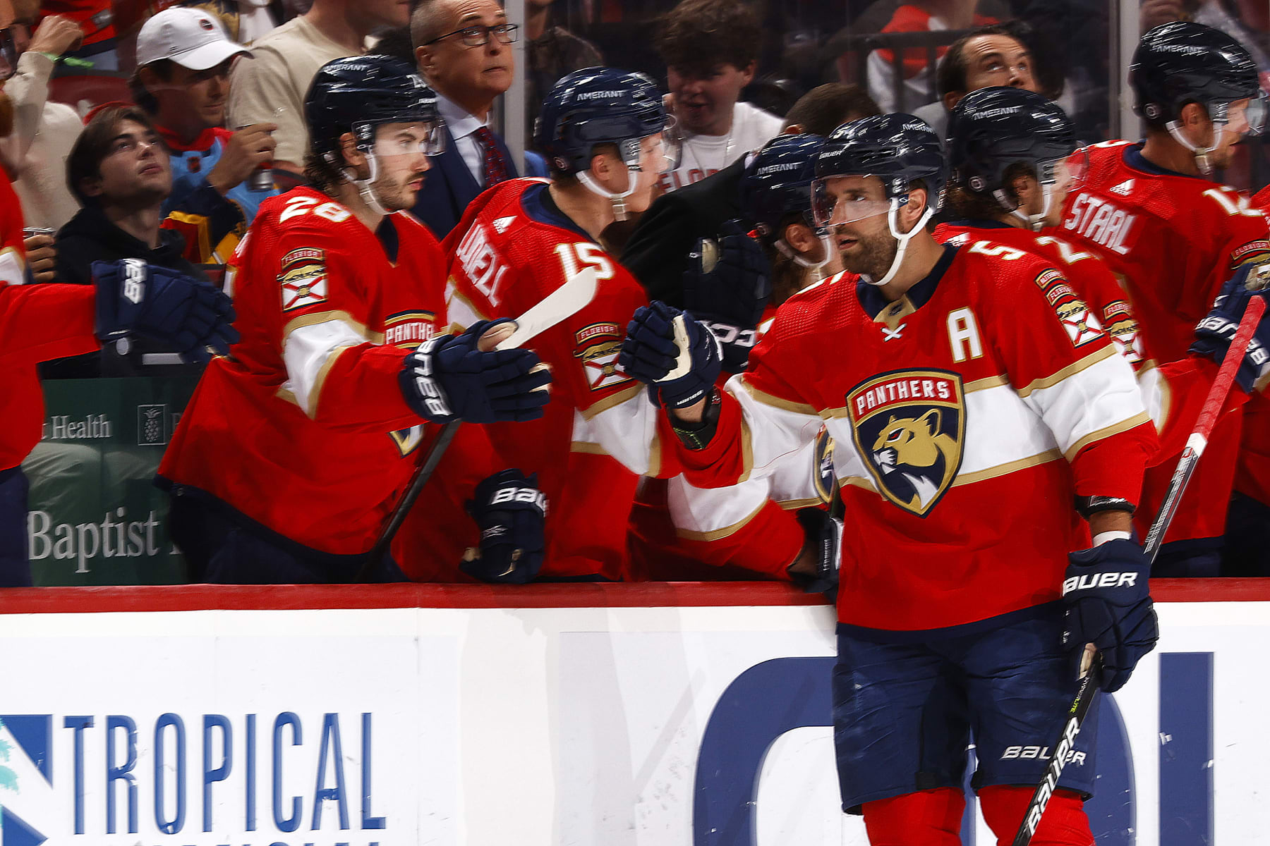 SUNRISE, FL - MARCH 16: Teammates congratulate Aaron Ekblad #5 of the Florida Panthers after he scored a second period goal against the Montreal Canadiens at the FLA Live Arena on March 16, 2023 in Sunrise, Florida. (Photo by Joel Auerbach/Getty Images)