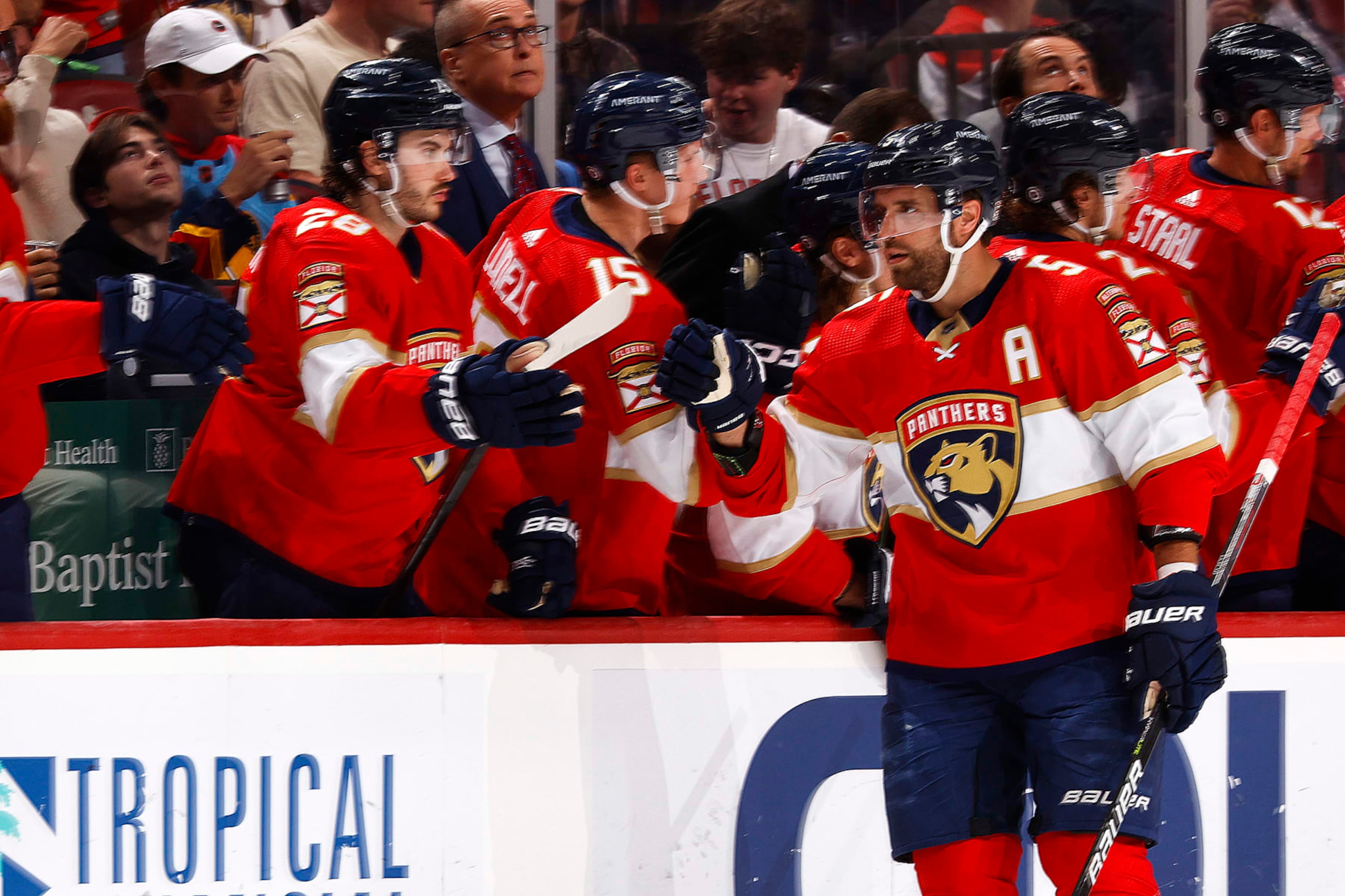 SUNRISE, FL - MARCH 16: Teammates congratulate Aaron Ekblad #5 of the Florida Panthers after he scored a second period goal against the Montreal Canadiens at the FLA Live Arena on March 16, 2023 in Sunrise, Florida. (Photo by Joel Auerbach/Getty Images)