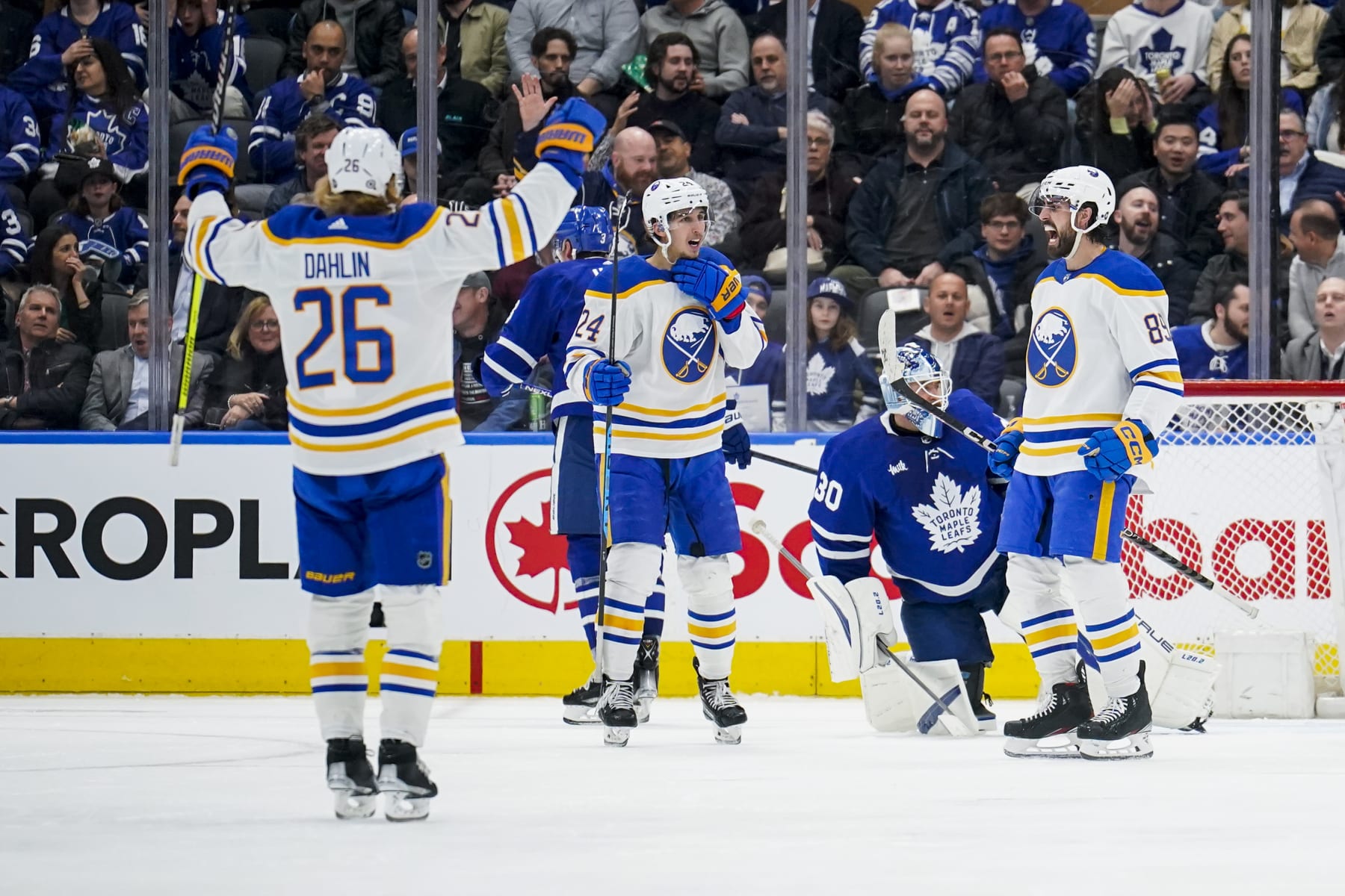 TORONTO, ON - MARCH 13: Alex Tuch #89 of the Buffalo Sabres celebrates his second goal of the game against the Toronto Maple Leafs with teammates Rasmus Dahlin #26 and Dylan Cozens #24 during the third period at the Scotiabank Arena on March 13, 2023 in Toronto, Ontario, Canada. (Photo by Andrew Lahodynskyj/NHLI via Getty Images)