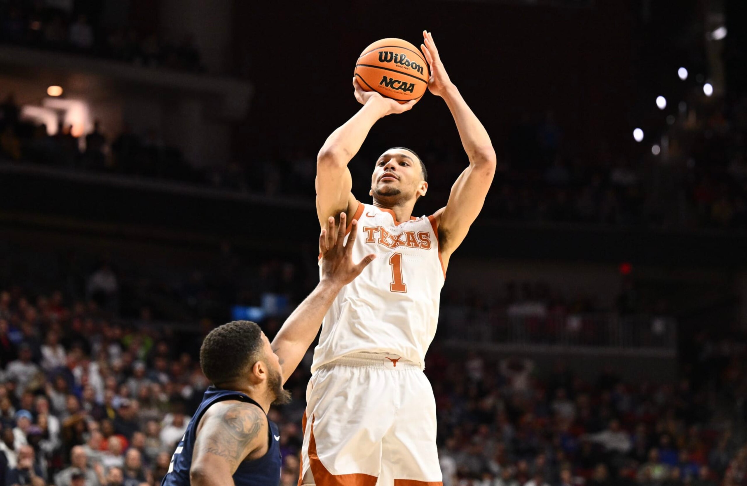 DES MOINES, IA - MARCH 18: Dylan Disu #1 of the Texas Longhorns shoots against Myles Dread #2 of the Penn State Nittany Lions during the second round of the 2023 NCAA Men's Basketball Tournament held at Wells Fargo Arena on March 18, 2023 in Des Moines, Iowa. (Photo by Jamie Sabau/NCAA Photos via Getty Images)