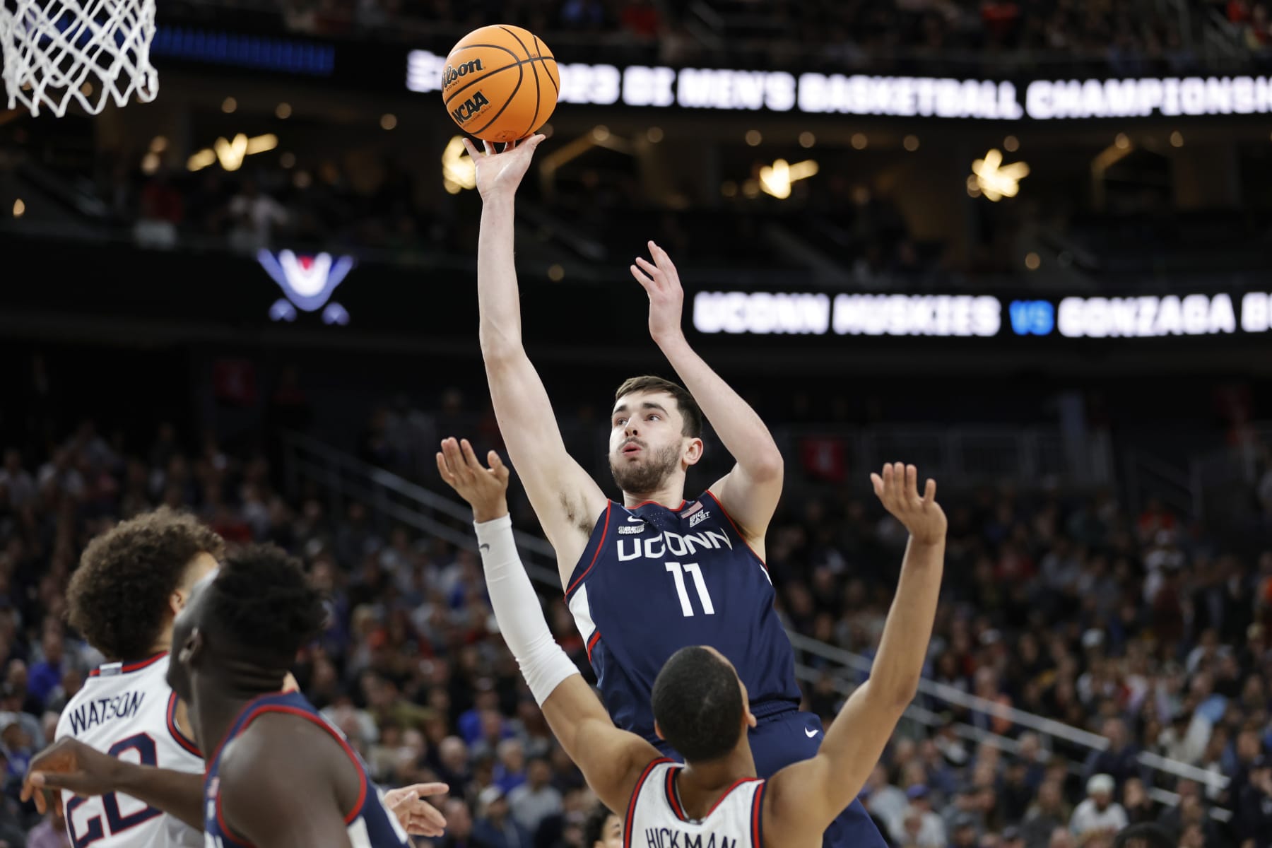 LAS VEGAS, NEVADA - MARCH 25: Alex Karaban #11 of the Connecticut Huskies shoots the ball against Nolan Hickman #11 of the Gonzaga Bulldogs during the first half in the Elite Eight round of the NCAA Men's Basketball Tournament at T-Mobile Arena on March 25, 2023 in Las Vegas, Nevada. (Photo by Carmen Mandato/Getty Images)