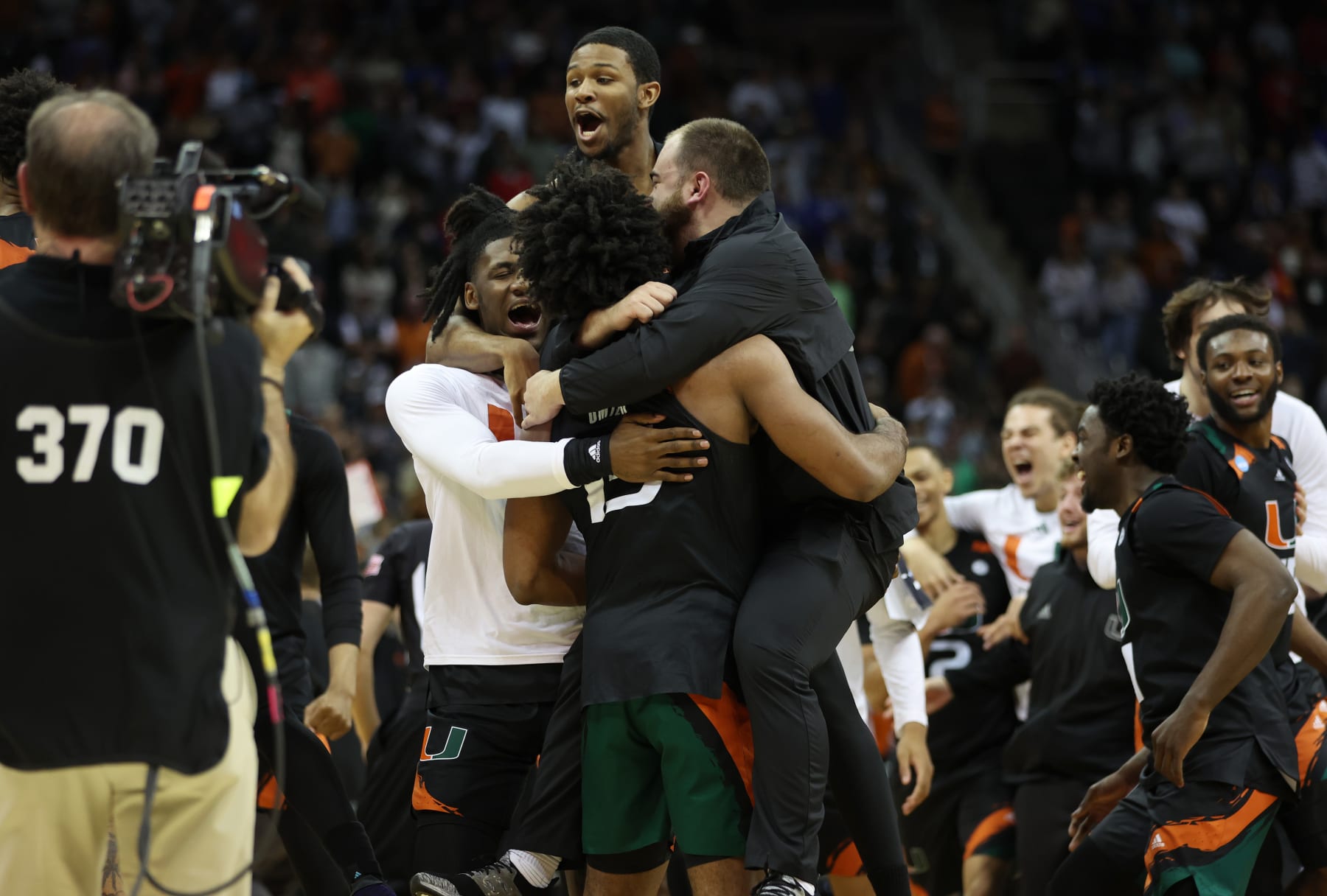 KANSAS CITY, MISSOURI - MARCH 26: The Miami Hurricanes celebrate defeating the Texas Longhorns 88-81 in the Elite Eight round of the NCAA Men's Basketball Tournament at T-Mobile Center on March 26, 2023 in Kansas City, Missouri. (Photo by Gregory Shamus/Getty Images)