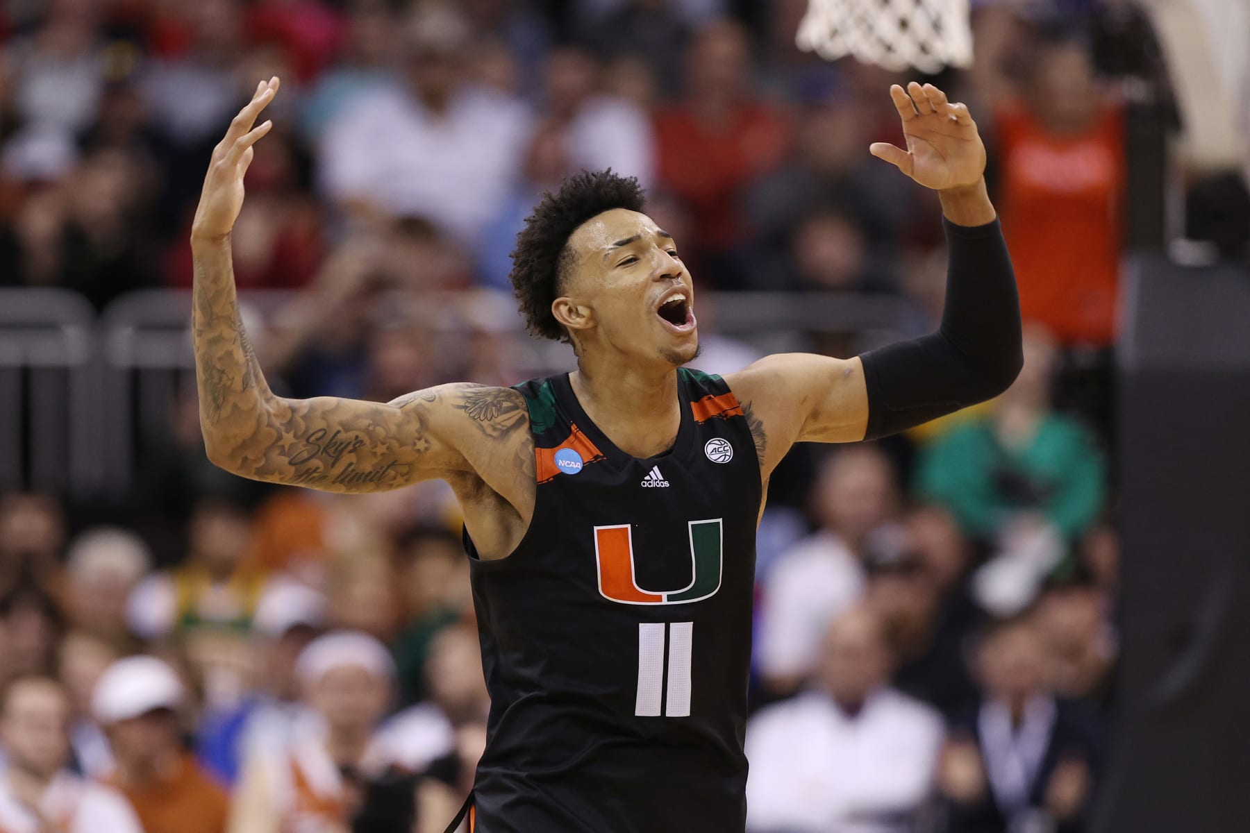 KANSAS CITY, MISSOURI - MARCH 26: Jordan Miller #11 of the Miami Hurricanes celebrates during the second half against the Texas Longhorns in the Elite Eight round of the NCAA Men's Basketball Tournament at T-Mobile Center on March 26, 2023 in Kansas City, Missouri. (Photo by Jamie Squire/Getty Images)