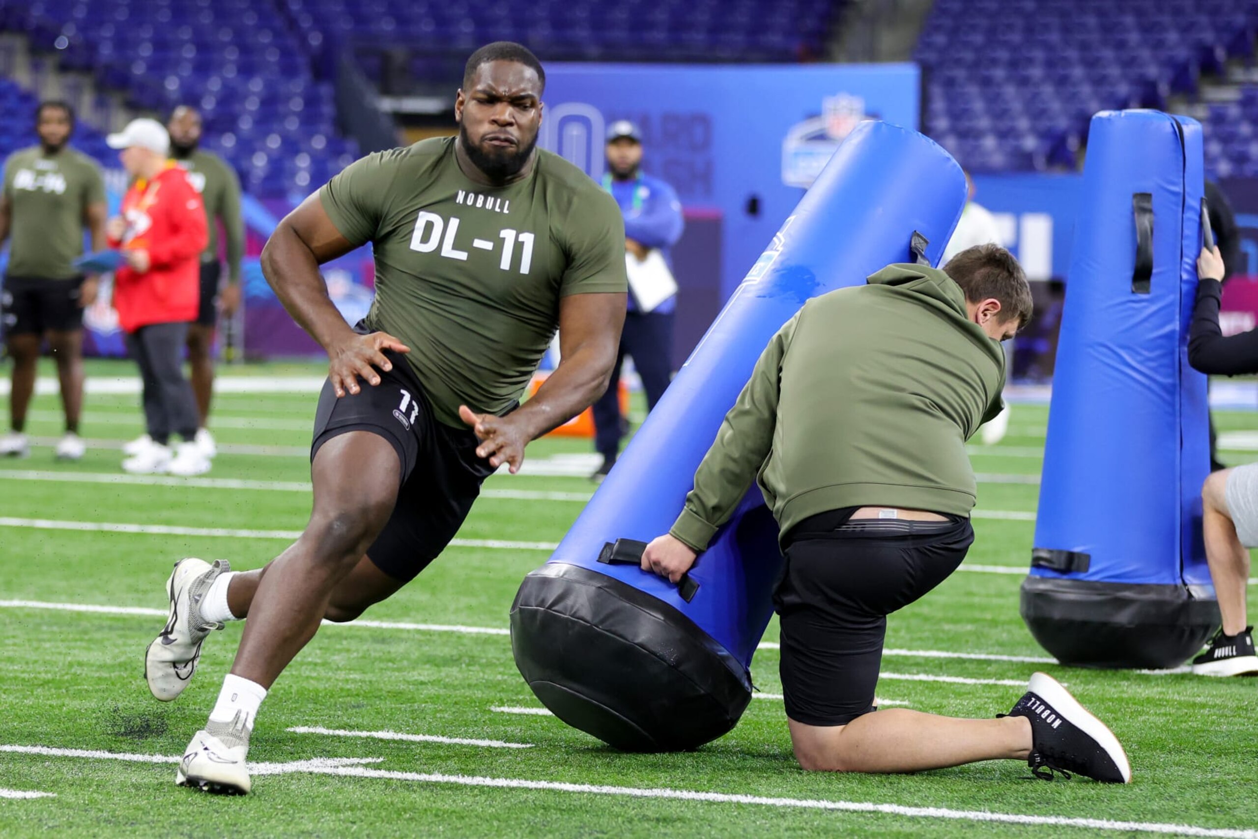 INDIANAPOLIS, INDIANA - MARCH 02: Defensive lineman Moro Ojomo of Texas participates in a drill during the NFL Combine at Lucas Oil Stadium on March 02, 2023 in Indianapolis, Indiana. (Photo by Stacy Revere/Getty Images)