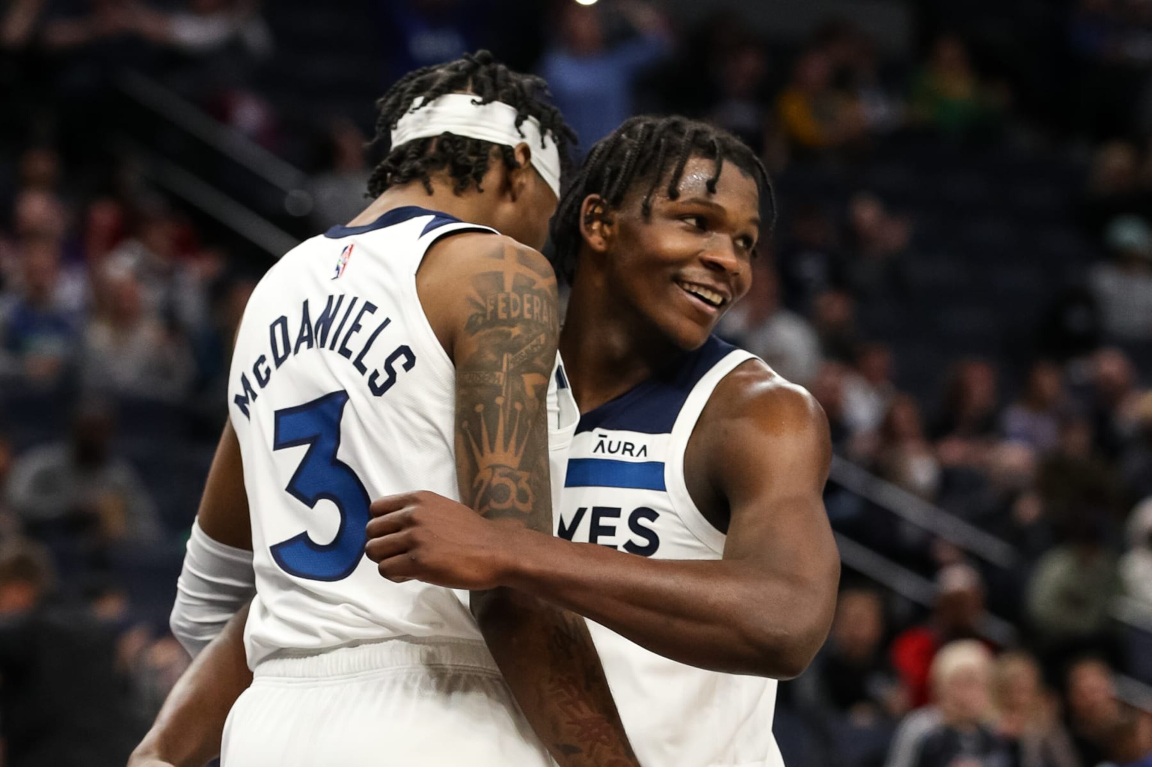 MINNEAPOLIS, MN - NOVEMBER 17: Anthony Edwards #1 celebrates with Jaden McDaniels #3 of the Minnesota Timberwolves after McDaniels drew a foul against the Sacramento Kings in the fourth quarter of the game at Target Center on November 17, 2021 in Minneapolis, Minnesota. The Timberwolves defeated the Kings 107-97. NOTE TO USER: User expressly acknowledges and agrees that, by downloading and or using this Photograph, user is consenting to the terms and conditions of the Getty Images License Agreement. (Photo by David Berding/Getty Images)