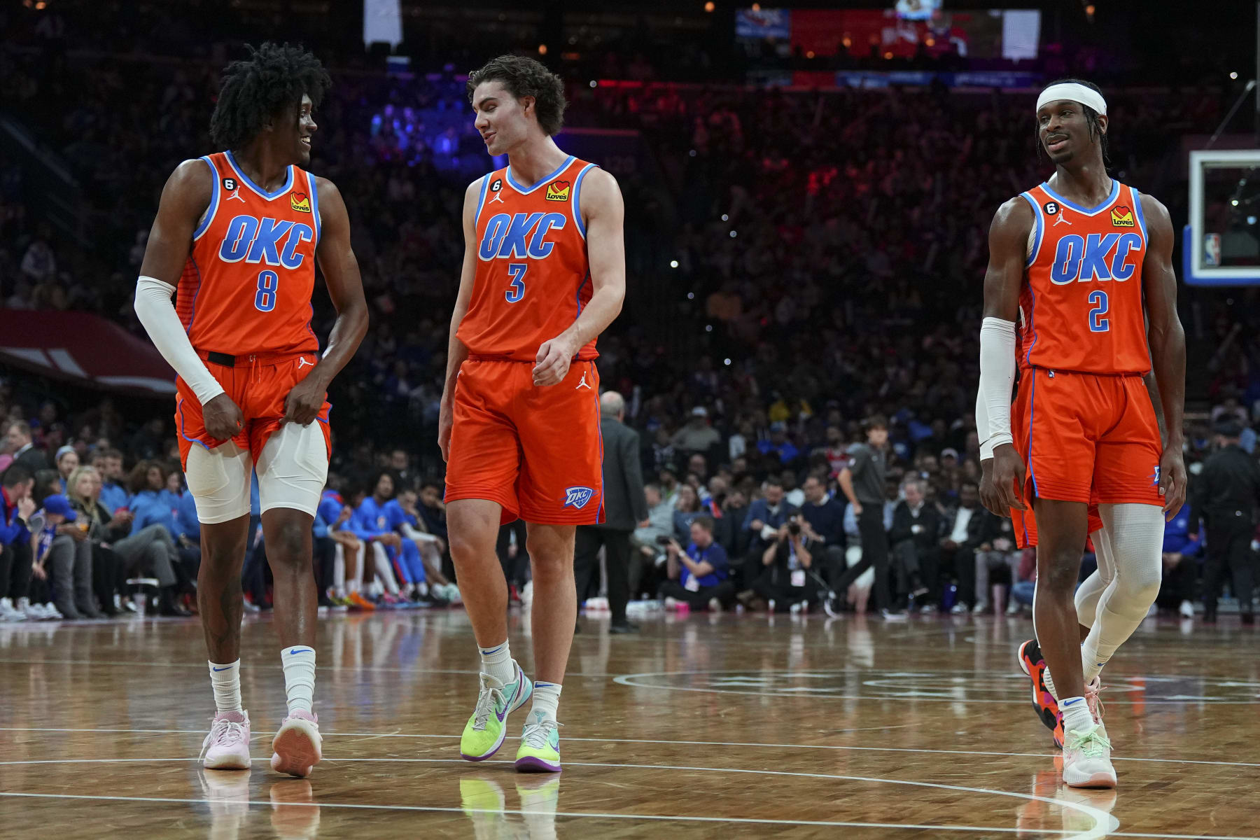 PHILADELPHIA, PA - JANUARY 12: Jalen Williams #8, Josh Giddey #3, and Shai Gilgeous-Alexander #2 of the Oklahoma City Thunder look on against the Philadelphia 76ers at the Wells Fargo Center on January 12, 2023 in Philadelphia, Pennsylvania. NOTE TO USER: User expressly acknowledges and agrees that, by downloading and or using this photograph, User is consenting to the terms and conditions of the Getty Images License Agreement. (Photo by Mitchell Leff/Getty Images)