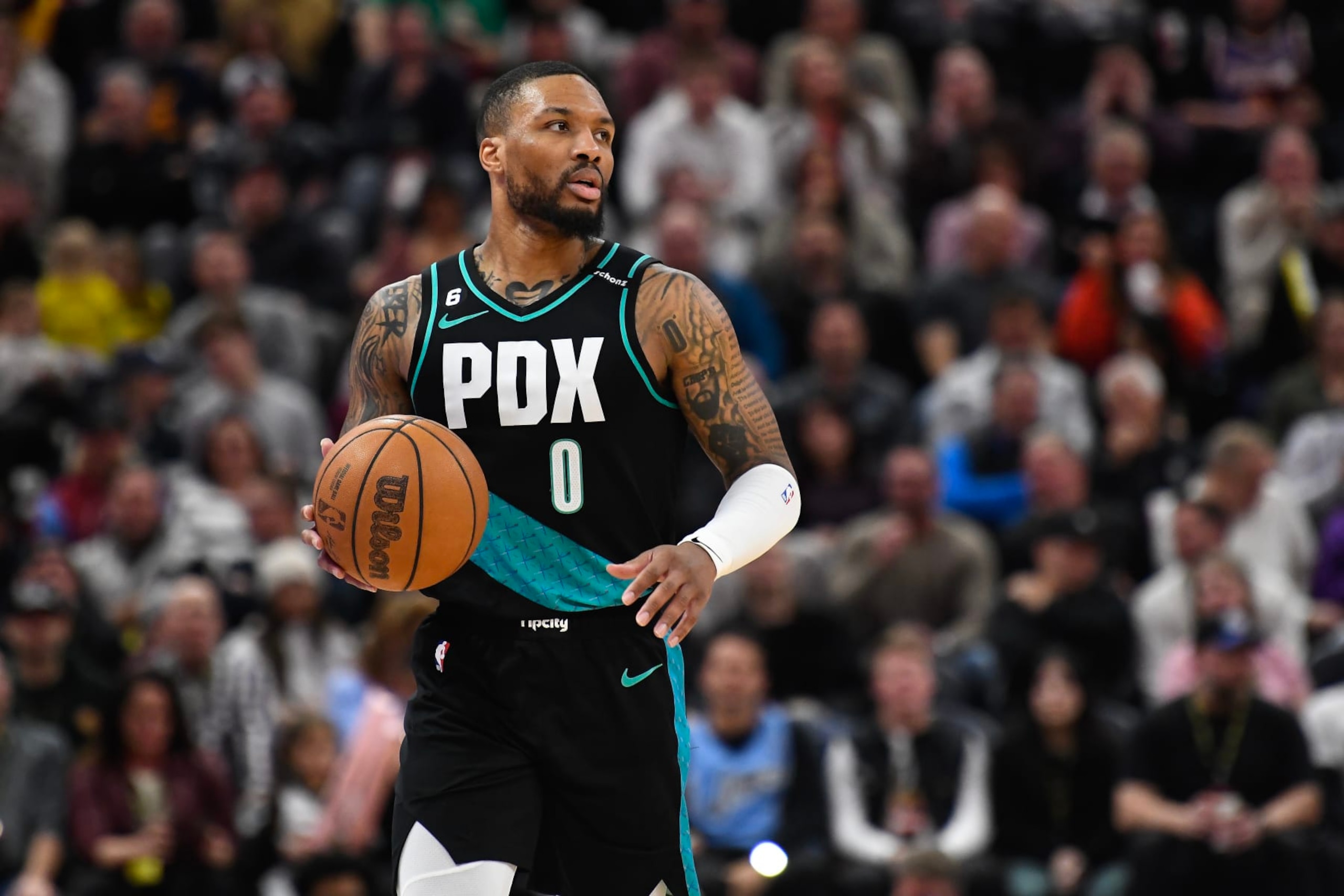 SALT LAKE CITY, UTAH - MARCH 22: Damian Lillard #0 of the Portland Trail Blazers brings the ball up court during the second half against the Utah Jazz at Vivint Arena on March 22, 2023 in Salt Lake City, Utah. NOTE TO USER: User expressly acknowledges and agrees that, by downloading and or using this photograph, User is consenting to the terms and conditions of the Getty Images License Agreement. (Photo by Alex Goodlett/Getty Images)