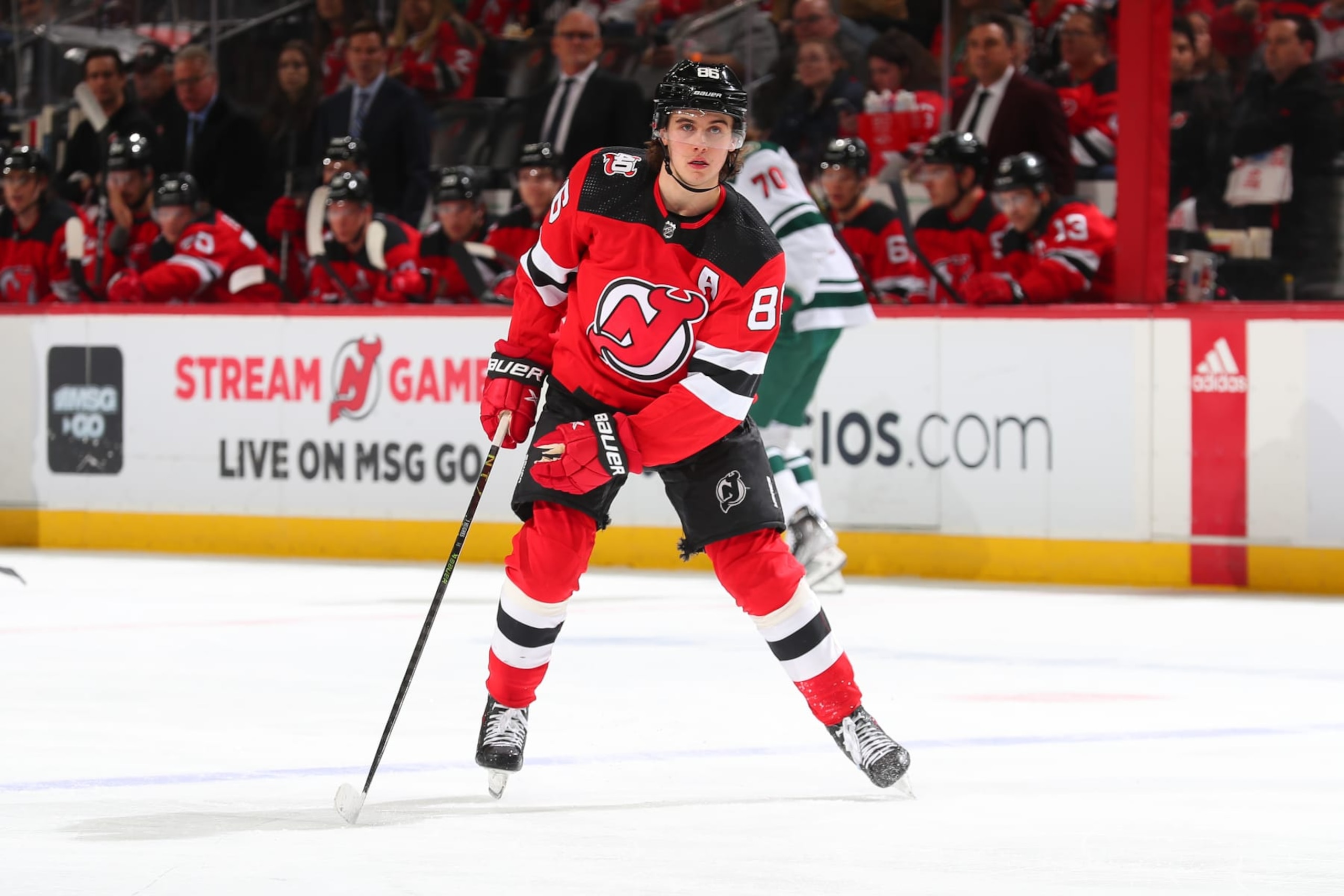 NEWARK, NJ - MARCH 21: Jack Hughes #86 of the New Jersey Devils skates in the first period of the game against the Minnesota Wild on March 21, 2023 at the Prudential Center in Newark, New Jersey.  (Photo by Rich Graessle/NHLI via Getty Images)