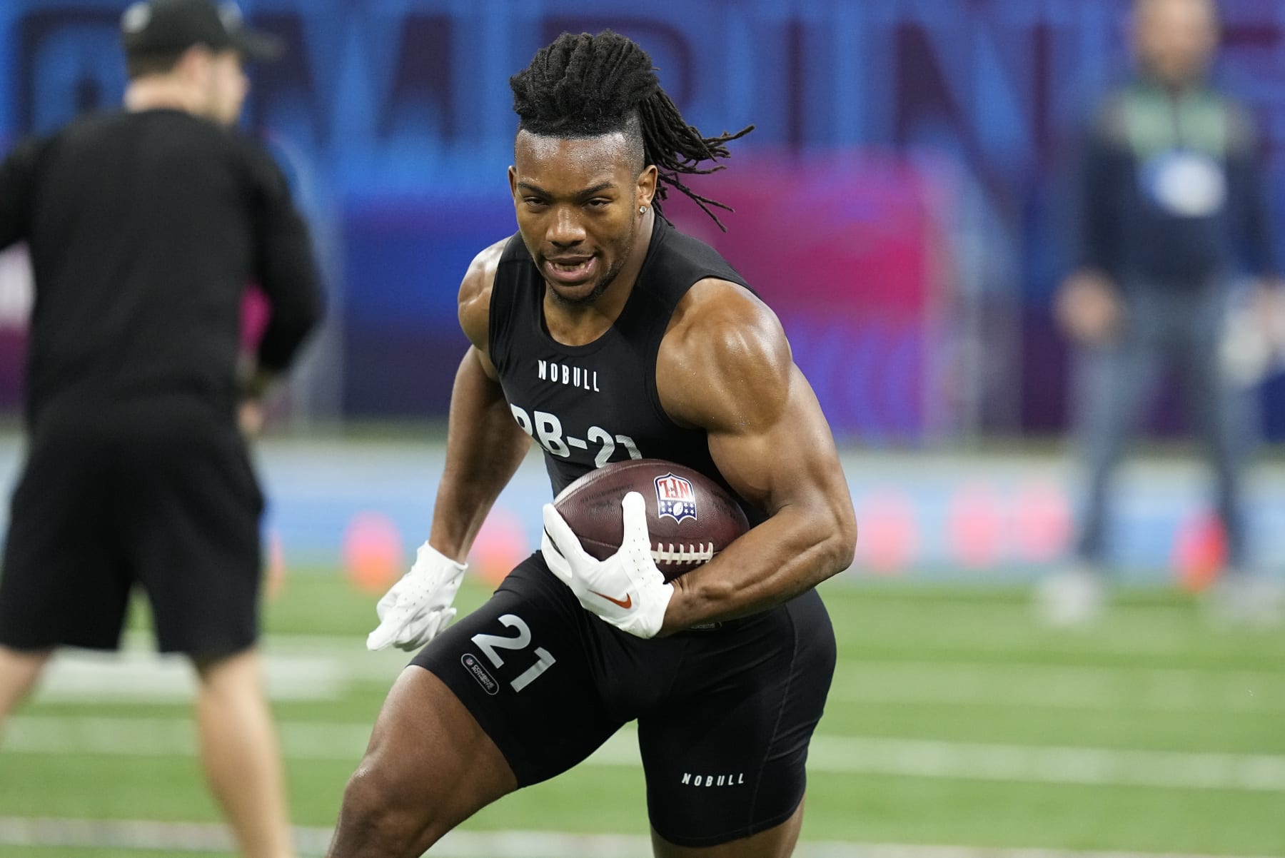 Texas running back Bijan Robinson runs a drill at the NFL football scouting combine in Indianapolis, Sunday, March 5, 2023. (AP Photo/Darron Cummings)
