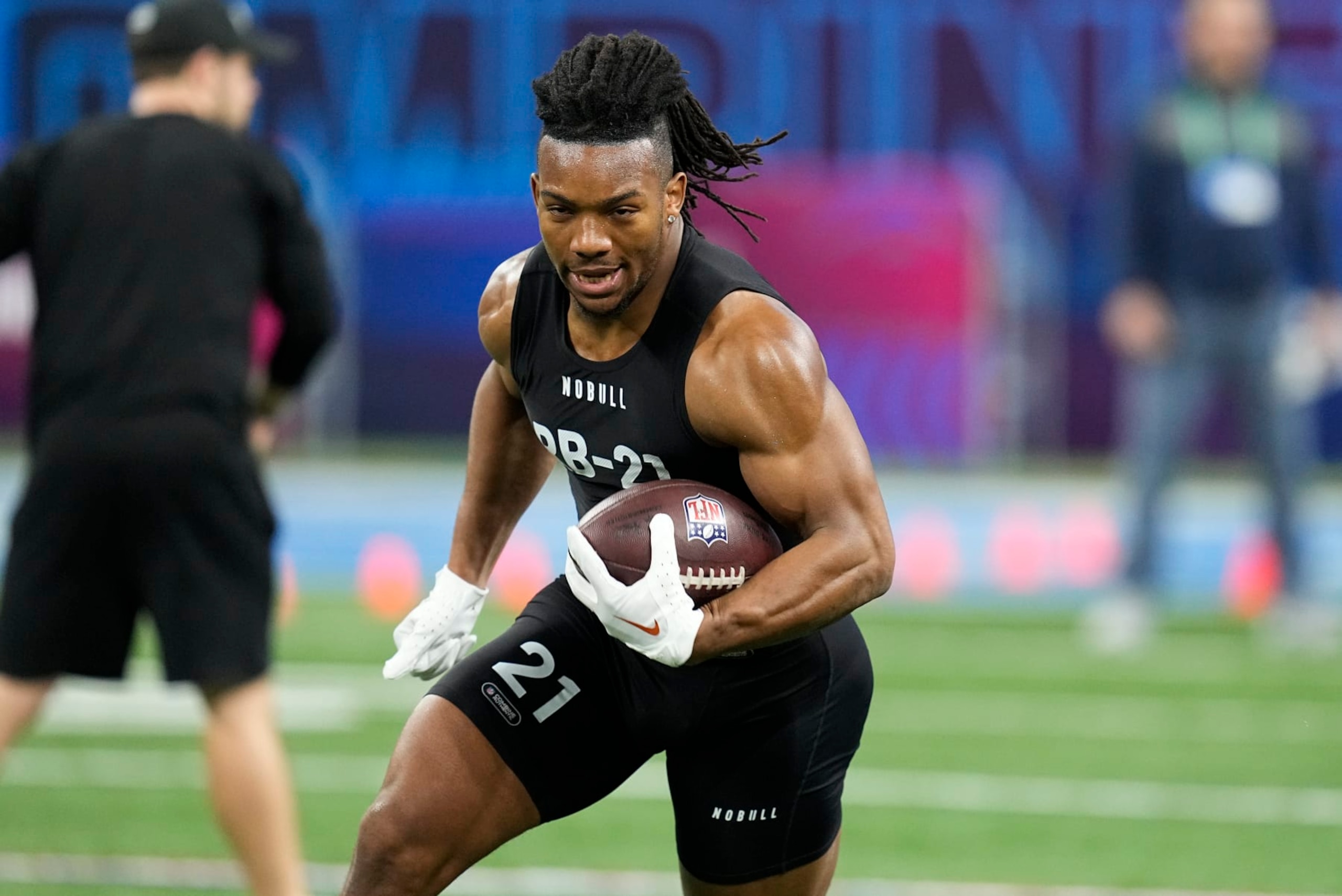 Texas running back Bijan Robinson runs a drill at the NFL football scouting combine in Indianapolis, Sunday, March 5, 2023. (AP Photo/Darron Cummings)