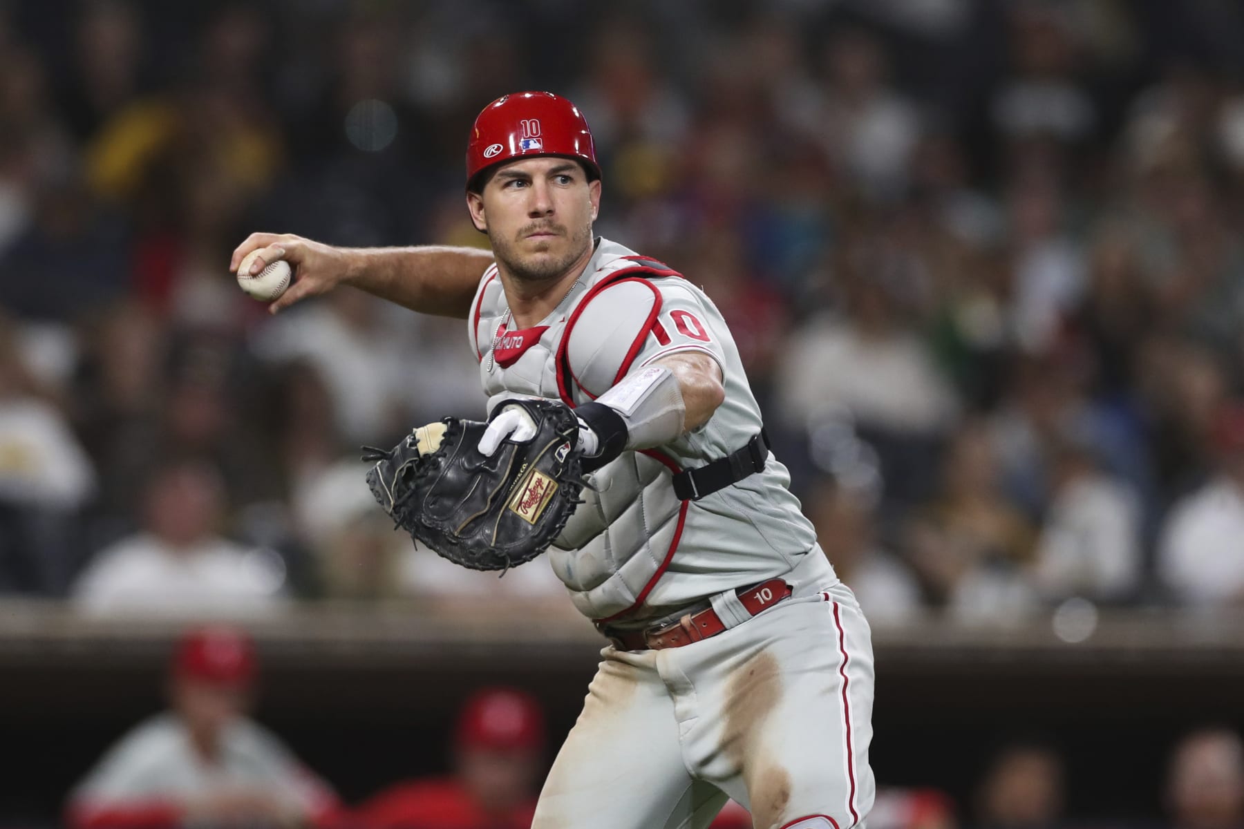 Philadelphia Phillies catcher J.T. Realmuto throws to first base for an out in a baseball game against the San Diego Padres, Saturday, June 25, 2022, in San Diego. (AP Photo/Derrick Tuskan)