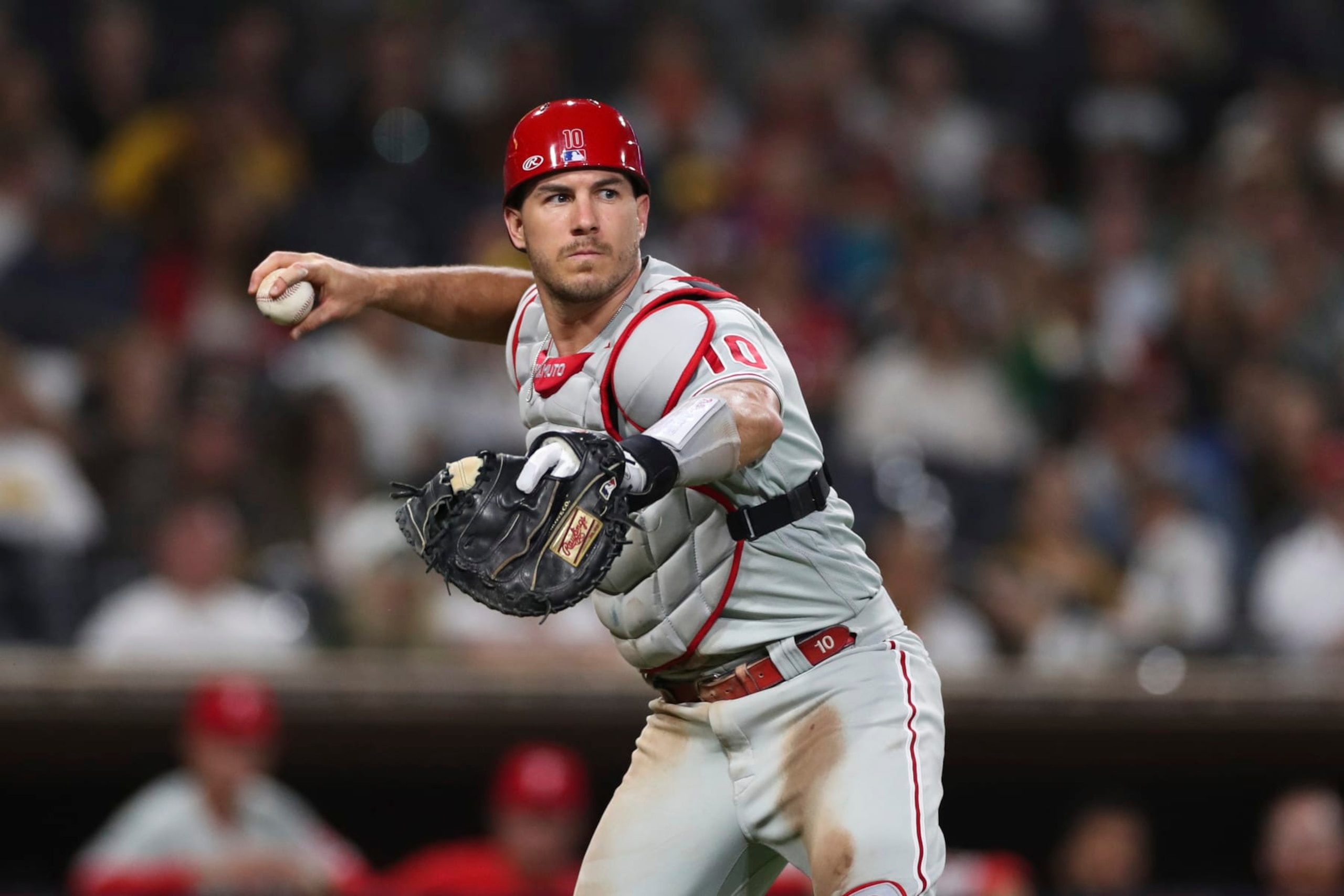 Philadelphia Phillies catcher J.T. Realmuto throws to first base for an out in a baseball game against the San Diego Padres, Saturday, June 25, 2022, in San Diego. (AP Photo/Derrick Tuskan)