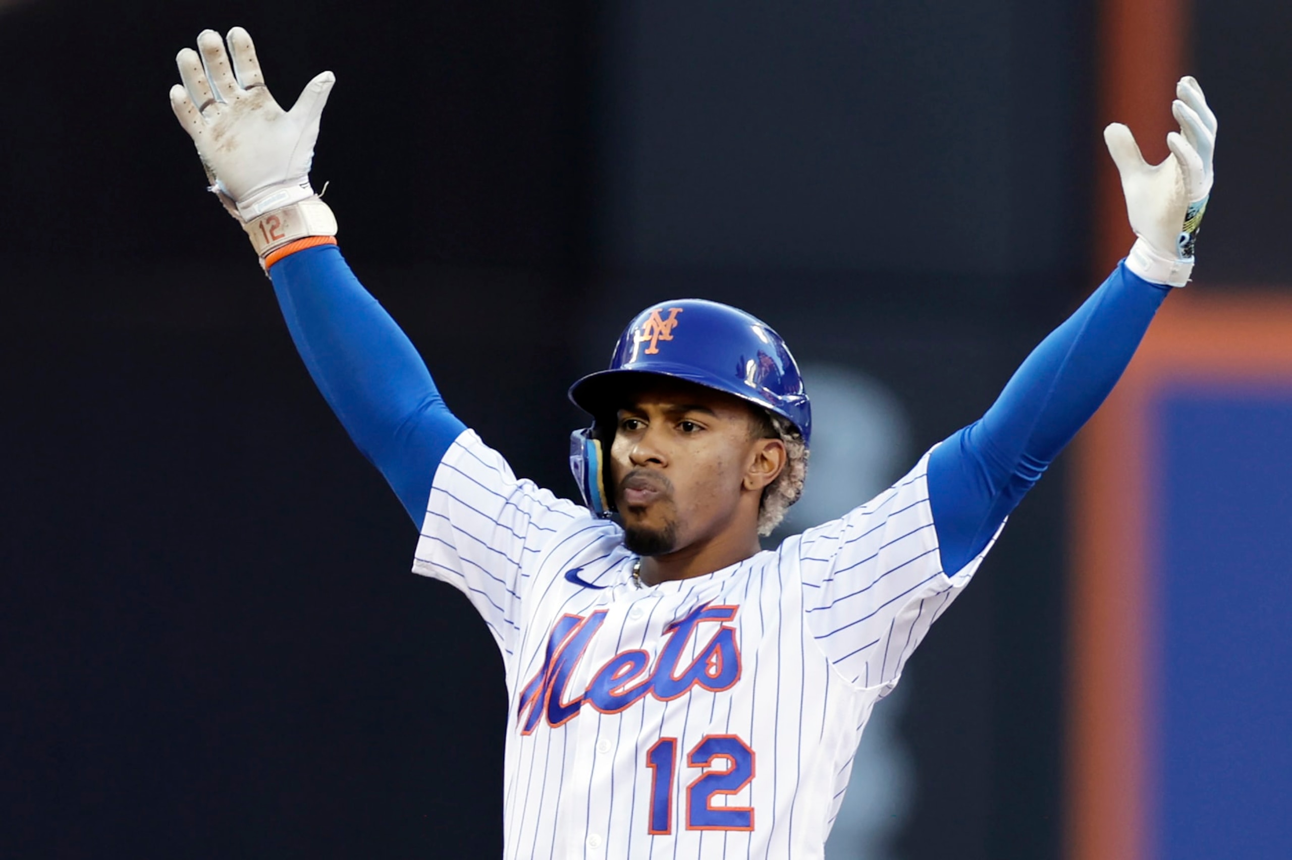 New York Mets' Francisco Lindor reacts after hitting an RBI double against the Los Angeles Dodgers during the sixth inning of a baseball game Thursday, Sept. 1, 2022, in New York. (AP Photo/Adam Hunger)
