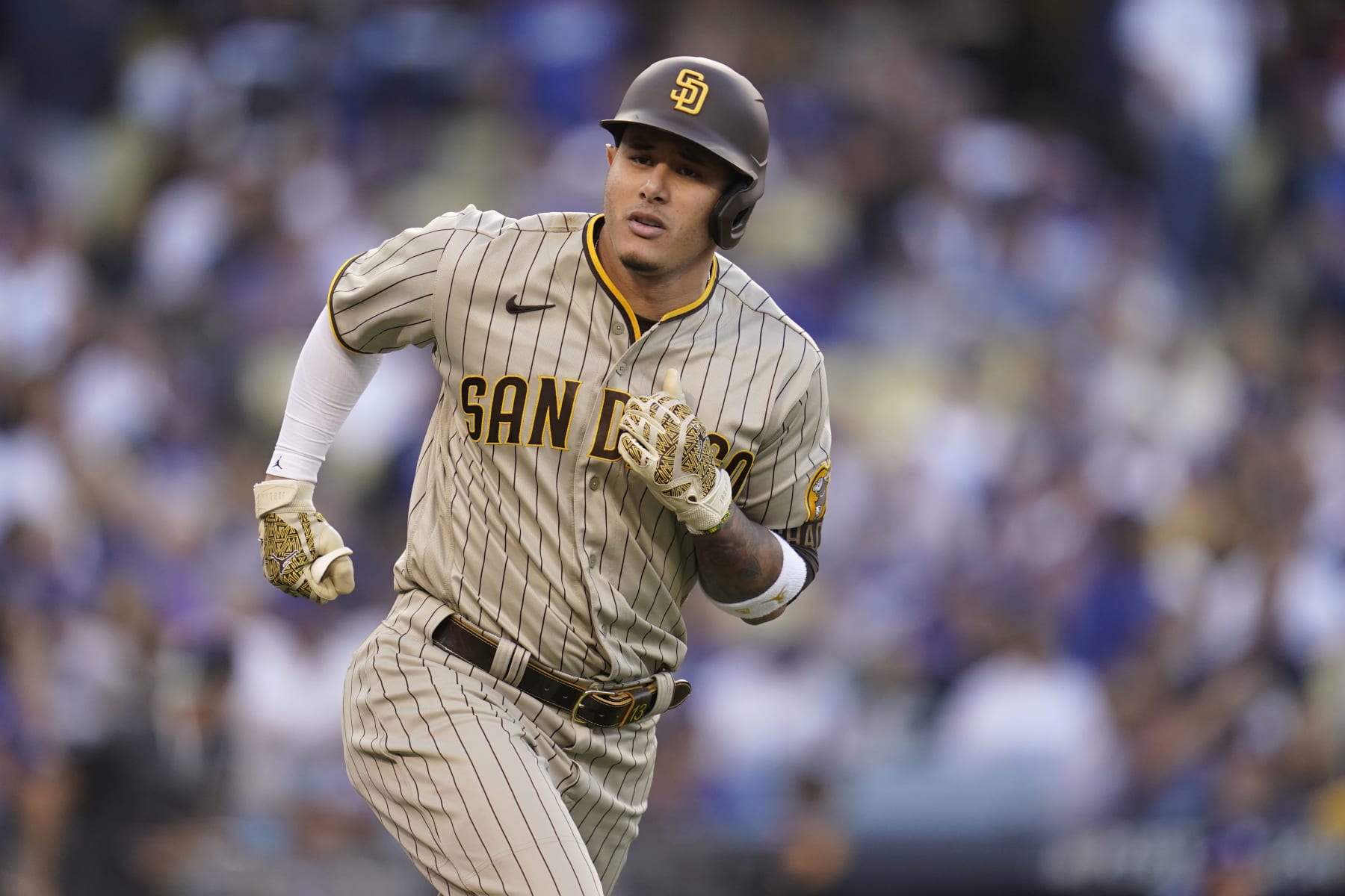 San Diego Padres' Manny Machado rounds first base after hitting a solo home run during the first inning of Game 2 of the baseball team's NL Division Series against the Los Angeles Dodgers, Wednesday, Oct. 12, 2022, in Los Angeles. (AP Photo/Ashley Landis)