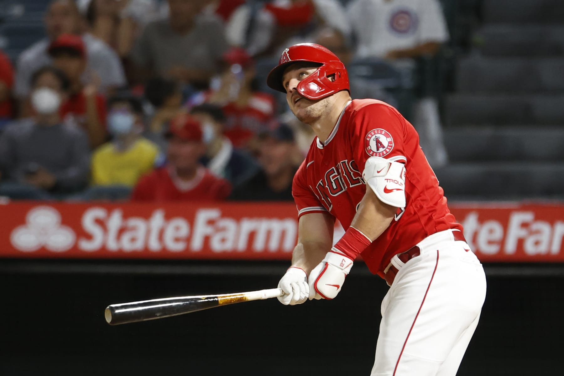 Los Angeles Angels' Mike Trout (27) looks at his a solo home run against the Detroit Tigers during the fifth inning of a baseball game in Anaheim, Calif., Monday, Sept. 5, 2022. (AP Photo/Ringo H.W. Chiu)