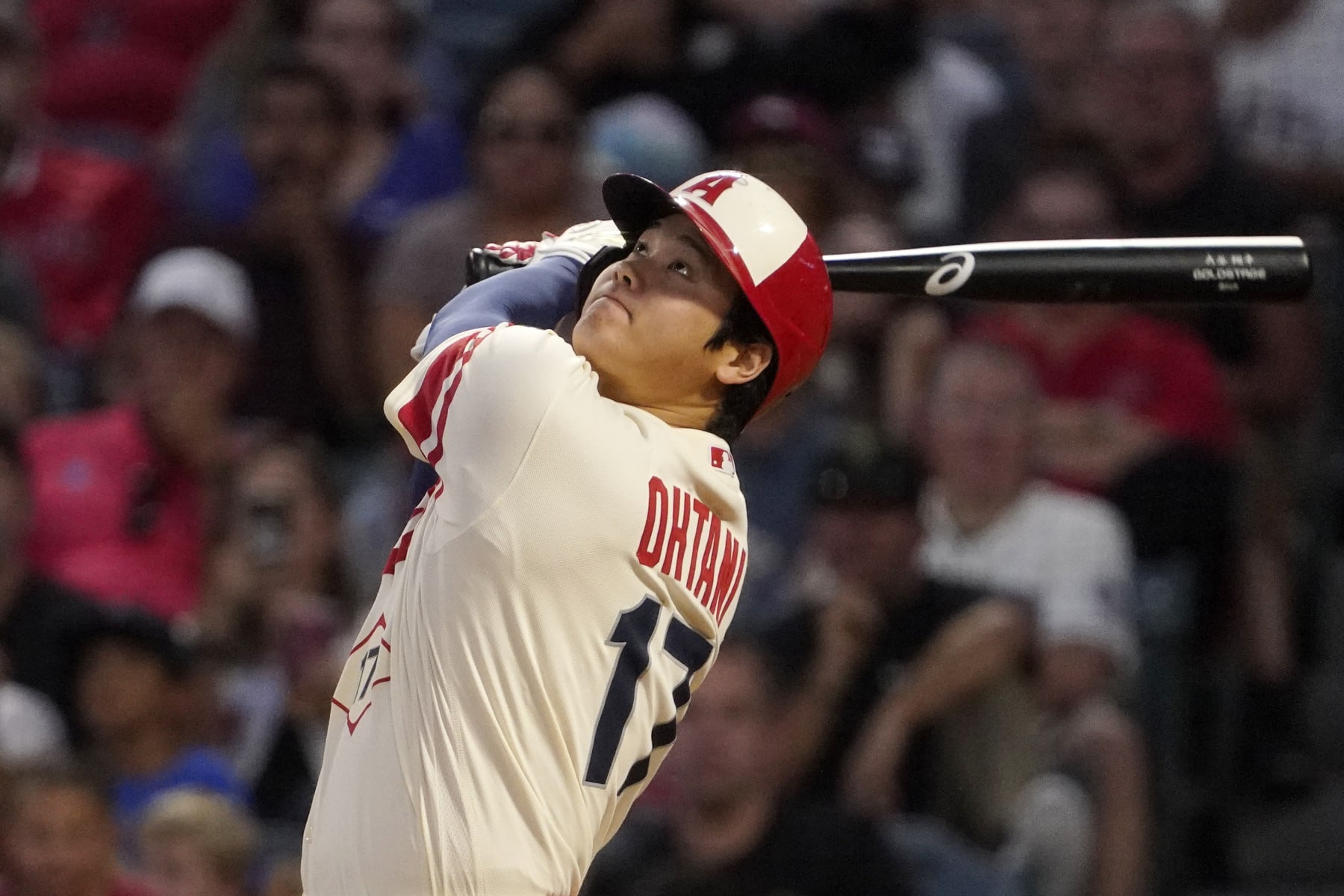 Los Angeles Angels' Shohei Ohtani swings as he hits a double during the first inning of a baseball game against the Seattle Mariners Friday, Sept. 16, 2022, in Anaheim, Calif. (AP Photo/Mark J. Terrill)