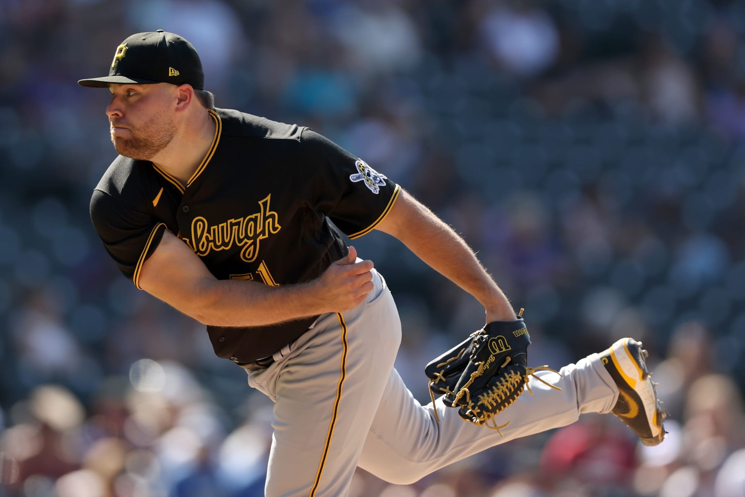 DENVER, COLORADO - JULY 17: Pitcher David Bednar #51 of the Pittsburgh Pirates throws against the Colorado Rockies in the ninth inning at Coors Field on July 17, 2022 in Denver, Colorado. (Photo by Matthew Stockman/Getty Images)