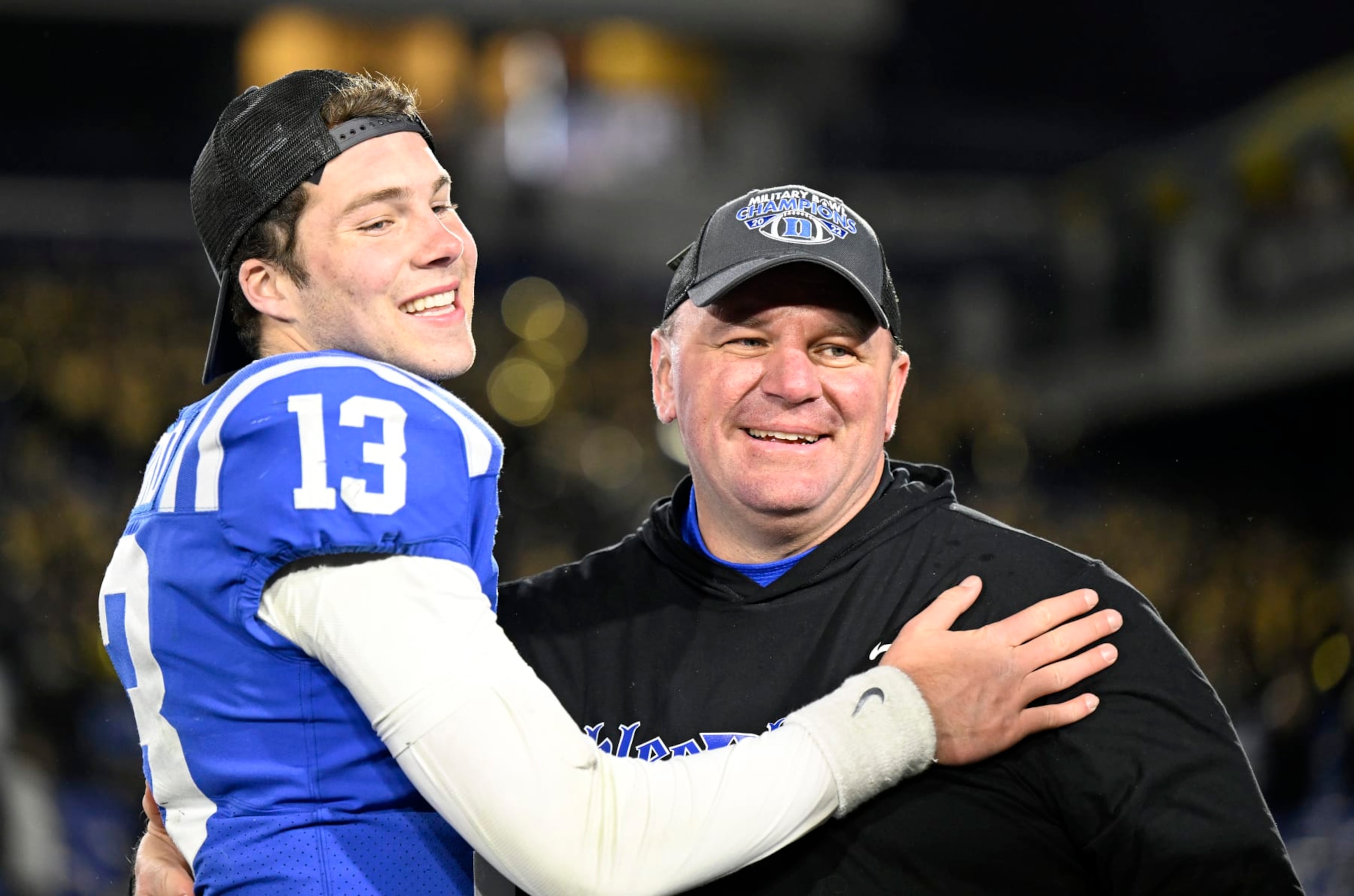 ANNAPOLIS, MARYLAND - DECEMBER 28: Head coach Mike Elko of the Duke Blue Devils  celebrates with Riley Leonard #13 after a victory against the UCF Knights in the Military Bowl Presented by Peraton  at Navy-Marine Corps Memorial Stadium on December 28, 2022 in Annapolis, Maryland. (Photo by Greg Fiume/Getty Images)