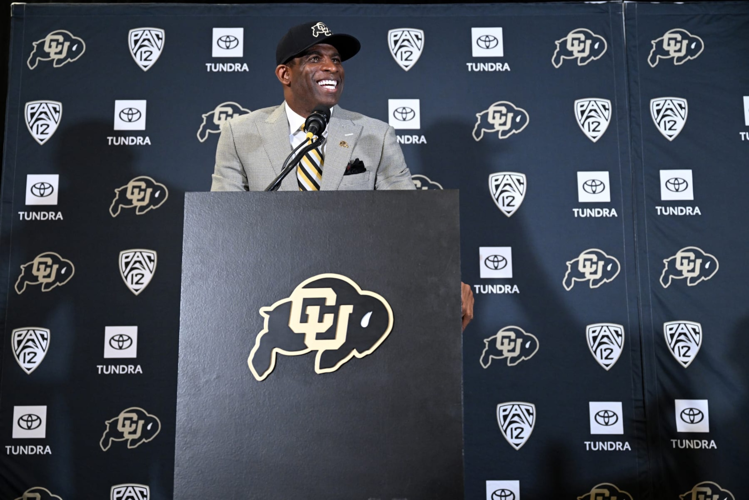 BOULDER, CO - DECEMBER 4:  Deion Sanders, CUs new head football coach, talks to a packed audience in the Arrow Touchdown Club during a press conference on December 4, 2022 in Boulder, Colorado. CU held an introductory press conference to announce the hiring of Deion Coach Prime Sanders as the schools new head football coach. Chancellor Phil DiStefano and athletic director Rick George accompanied Sanders into a packed room in the Arrow Touchdown Club inside the Dal Ward Athletic Center. Sanders becomes the 28th head coach in Buffalo football history.  Sanders, who known as Prime Time during his Hall of Fame playing career has since transitioned into Coach Prime as a head football coach. Sanders, 55, joins the CU program from Jackson State University where in three seasons the Tigers compiled a 27-5 record and won back-to-back Southwestern Athletic Conference championships. (Photo by Helen H. Richardson/MediaNews Group/The Denver Post via Getty Images)