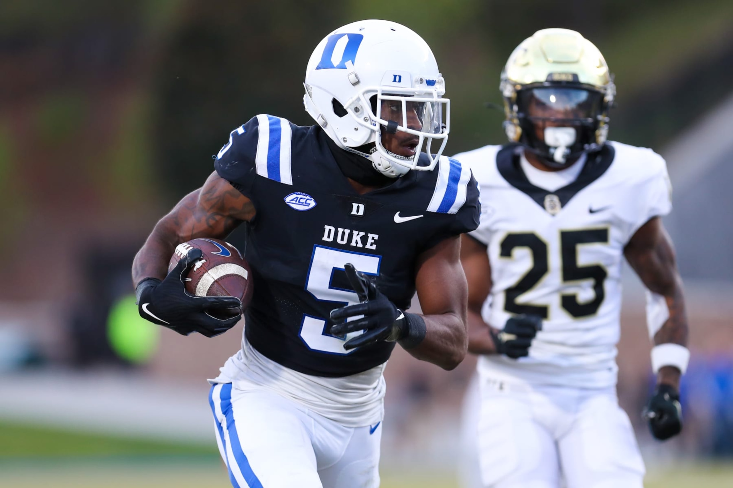DURHAM, NC - NOVEMBER 26: Jalon Calhoun (5) of the Duke Blue Devils runs the ball after making a catch during a football game between the Duke Blue Devils and the Wake Forest Demon Deacons on Nov 26, 2022 at Wallace Wade Stadium in Durham, NC. (Photo by David Jensen/Icon Sportswire via Getty Images)