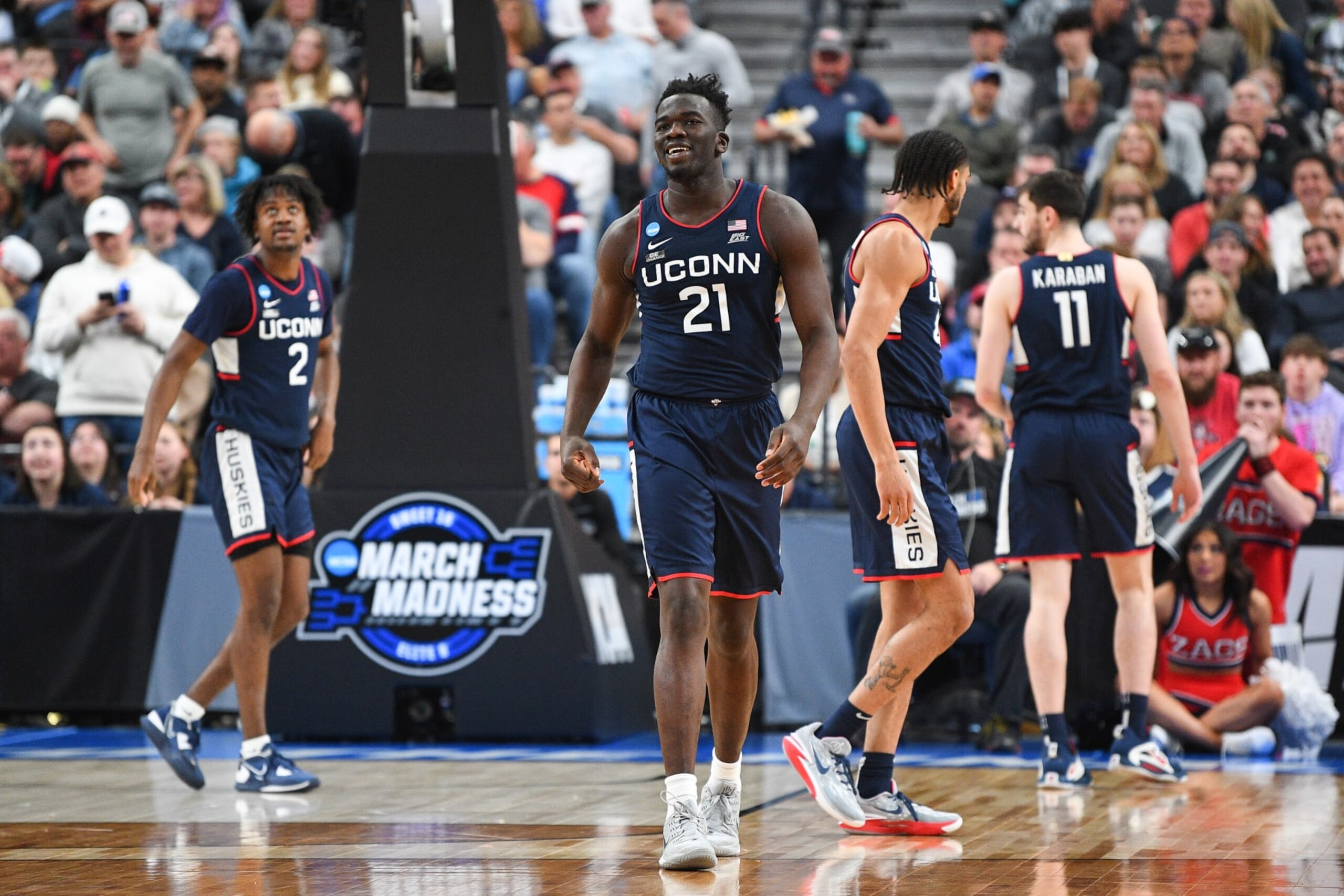 LAS VEGAS, NV - MARCH 25: UConn Huskies forward Adama Sanogo (21) looks on during the NCAA Division I Men's Championship Elite Eight round basketball game between the Gonzaga Bulldogs and the UConn Huskies on March 25, 2023 at T-Mobile Arena in Las Vegas, NV. (Photo by Brian Rothmuller/Icon Sportswire via Getty Images)