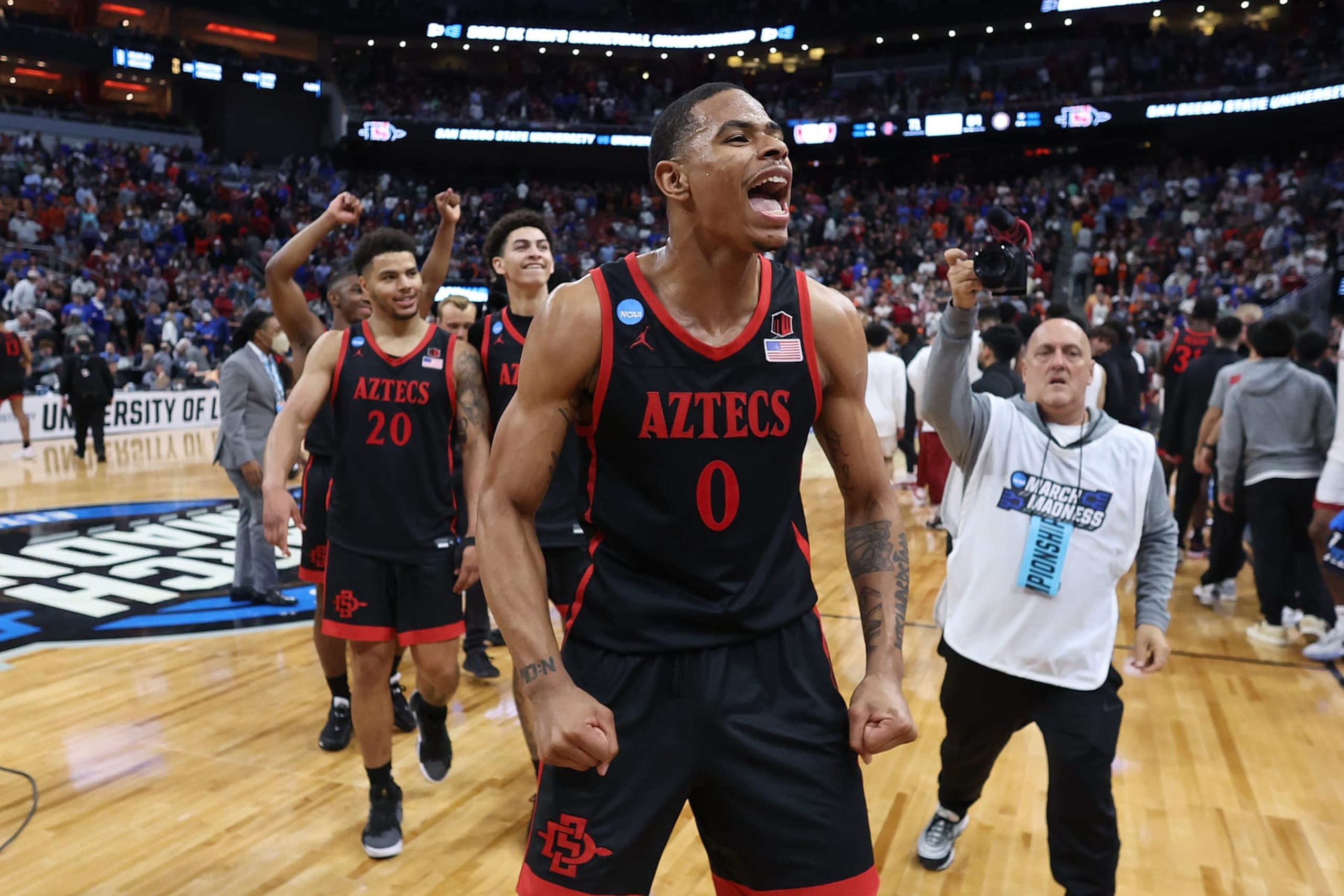 LOUISVILLE, KENTUCKY - MARCH 24: Keshad Johnson #0 of the San Diego State Aztecs and Matt Bradley #20 of the San Diego State Aztecs celebrate after defeating the Alabama Crimson Tide, 71-64, during the second half in the Sweet 16 round of the NCAA Men's Basketball Tournament at KFC YUM! Center on March 24, 2023 in Louisville, Kentucky. (Photo by Rob Carr/Getty Images)