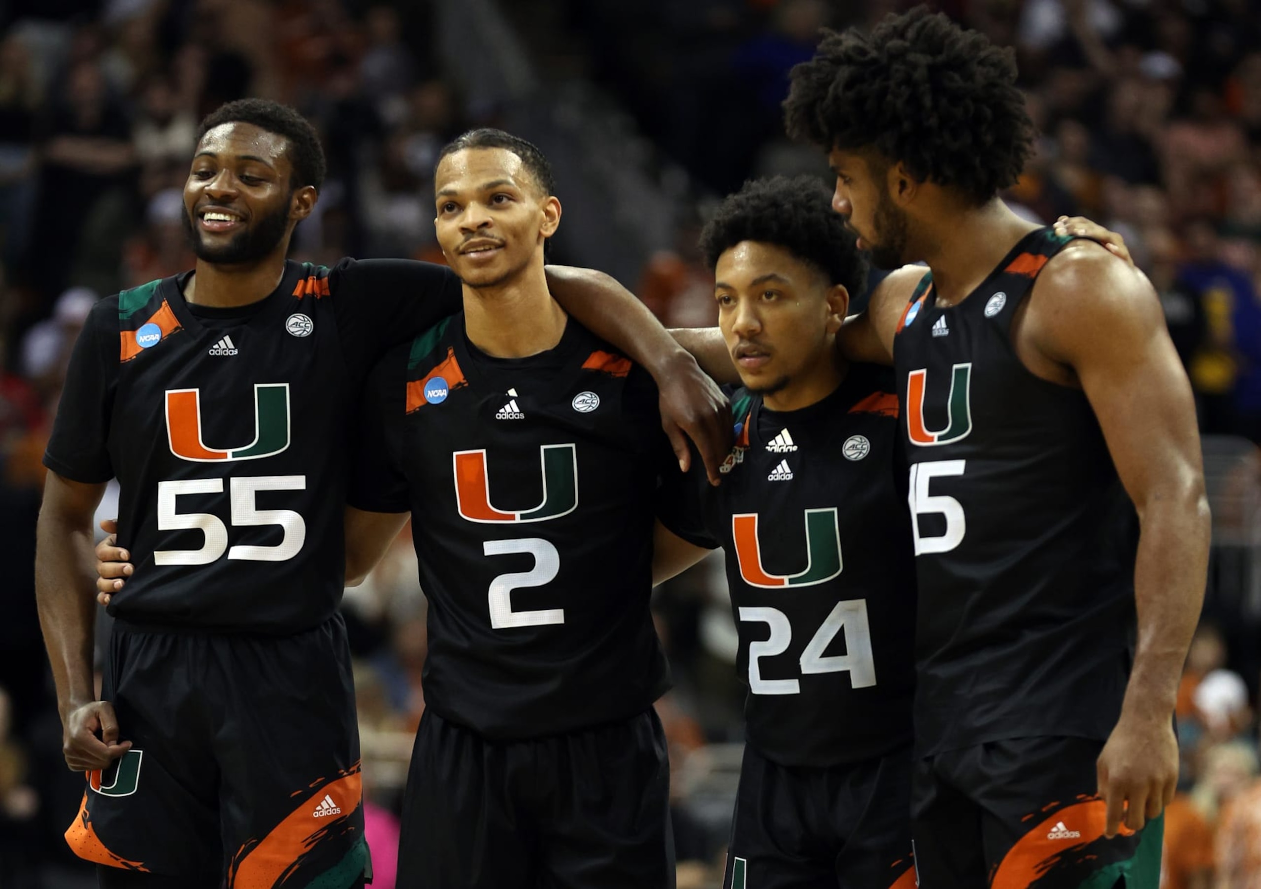 KANSAS CITY, MISSOURI - MARCH 26: (L-R) Wooga Poplar #55, Isaiah Wong #2, Nijel Pack #24 and Norchad Omier #15 of the Miami Hurricanes watch free throws during the second half against the Texas Longhorns in the Elite Eight round of the NCAA Men's Basketball Tournament at T-Mobile Center on March 26, 2023 in Kansas City, Missouri. (Photo by Jamie Squire/Getty Images)
