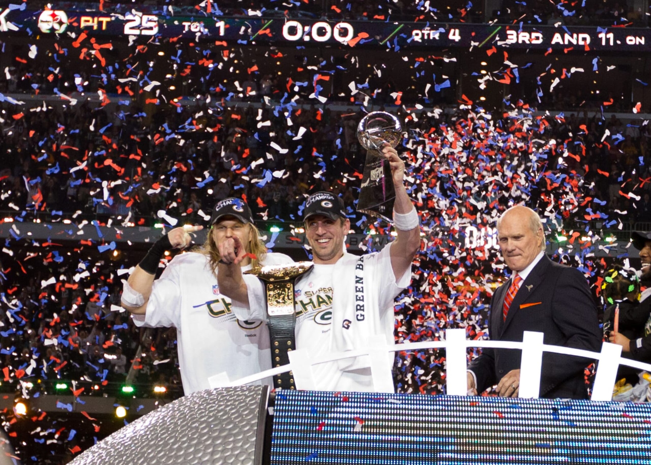 ARLINGTON, TX - FEBRUARY 06: Aaron Rodgers #12 and Clay Matthews #52 of the Green Bay Packers celebrate their victory against the Pittsburgh Steelers during Super Bowl XLV at Cowboys Stadium on February 6, 2011 in Arlington, Texas. The Packers defeated the Steelers 31-25. (Photo by Tom Hauck/Getty Images)