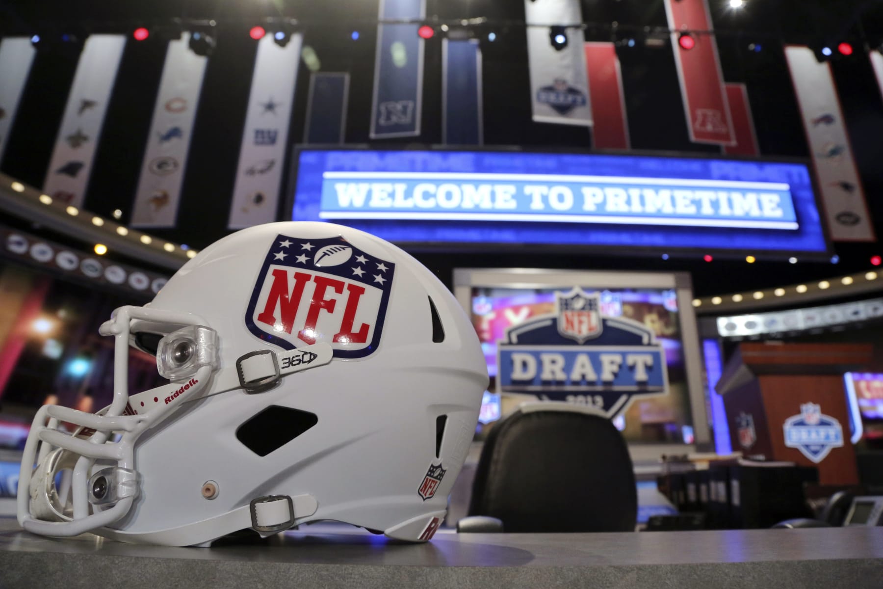 A helmet with the NFL logo is placed on a table before the NFL football draft, Thursday, April 25, 2013, at Radio City Music Hall in New York. (AP Photo/Mary Altaffer)
