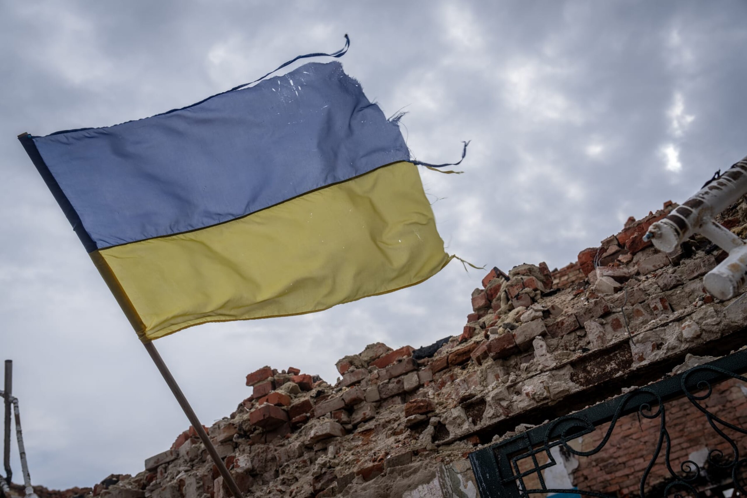 LUHANSK OBLAST, UKRAINE - MARCH 15: A Ukrainian flag on the wall of the destroyed school waves as Russian-Ukrainian war continues in Senkove village of Luhansk Oblast, Ukraine on March 15, 2023. (Photo by Wolfgang Schwan/Anadolu Agency via Getty Images)