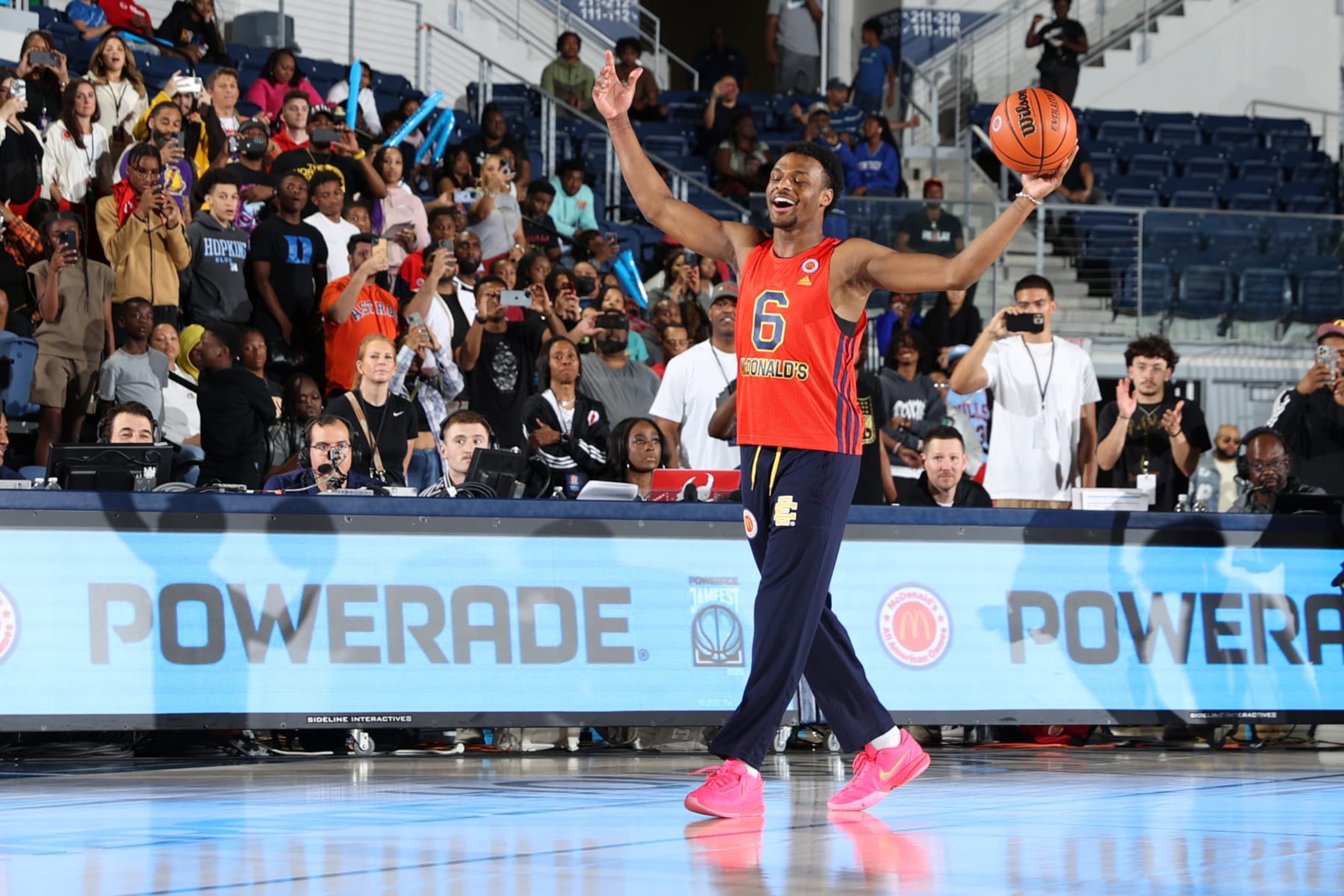 HOUSTON, TX - MARCH 27: McDonalds High School All American Bronny James (6) gets the crowd to cheer before dunking during the 2023 McDonalds High School All American Powerade Jamfest at Delmar Fieldhouse.(Photo by Brian Spurlock/Icon Sportswire via Getty Images)
