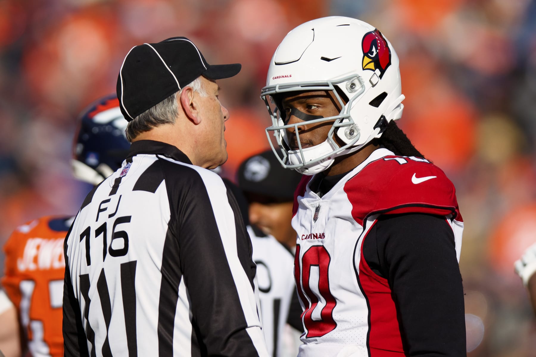 DENVER, CO - DECEMBER 18:  Wide receiver DeAndre Hopkins #10 of the Arizona Cardinals talks with a referee against the Denver Broncos in the first half at Empower Field at Mile High on December 18, 2022 in Denver, Colorado. (Photo by Justin Edmonds/Getty Images)