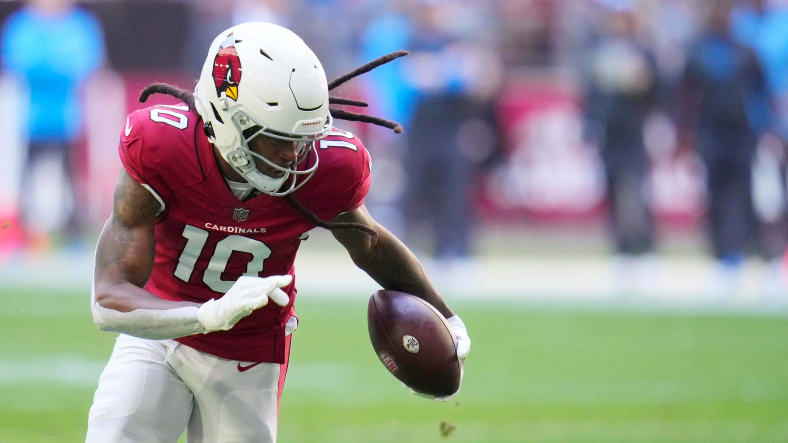 Arizona Cardinals wide receiver DeAndre Hopkins runs with the football after making a catch against the Los Angeles Chargers during the first half of an NFL football game in Glendale, Ariz., Sunday, Nov. 27, 2022. The Chargers won 25-24. (AP Photo/Ross D. Franklin)
