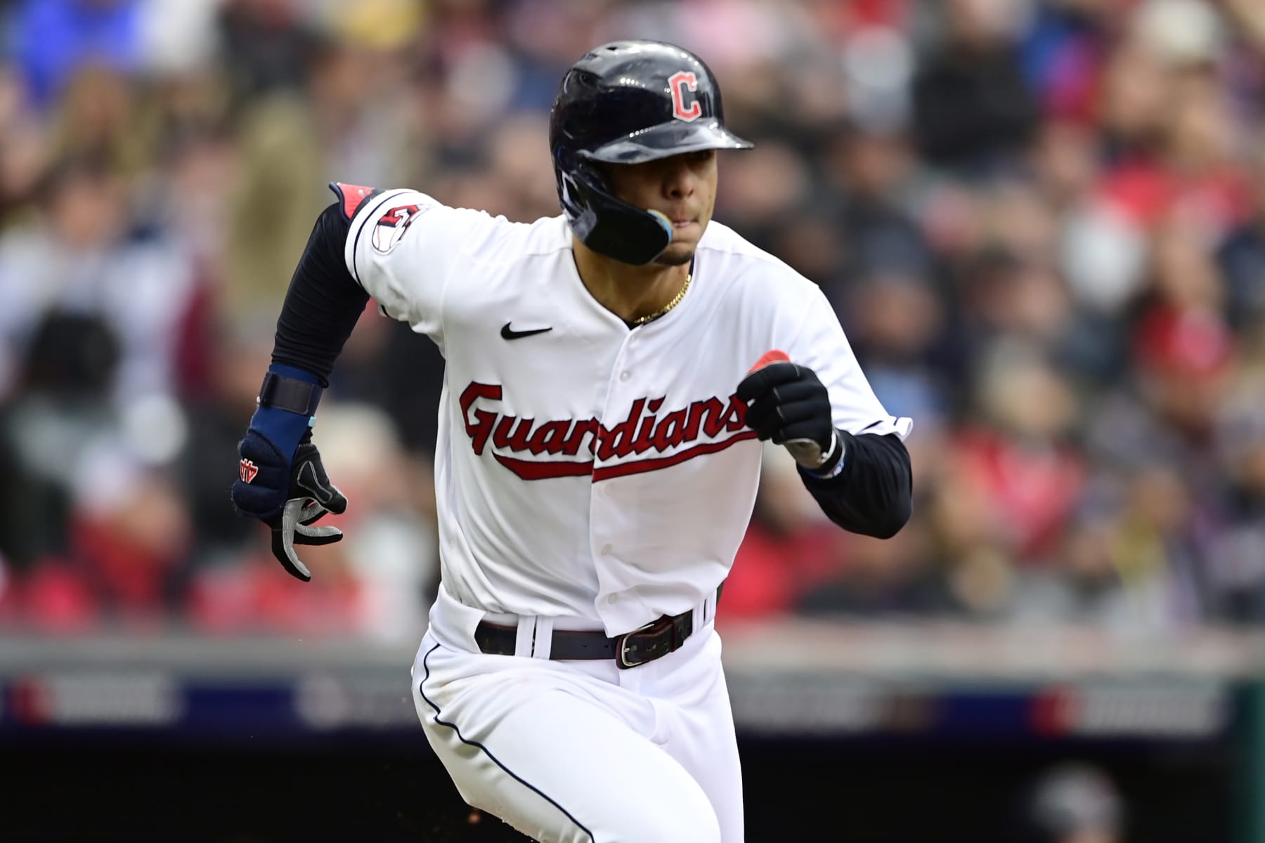 Cleveland Guardians' Andres Gimenez runs to first base with a single in the seventh inning of a wild card baseball playoff game against the Tampa Bay Rays, Friday, Oct. 7, 2022, in Cleveland. (AP Photo/David Dermer)