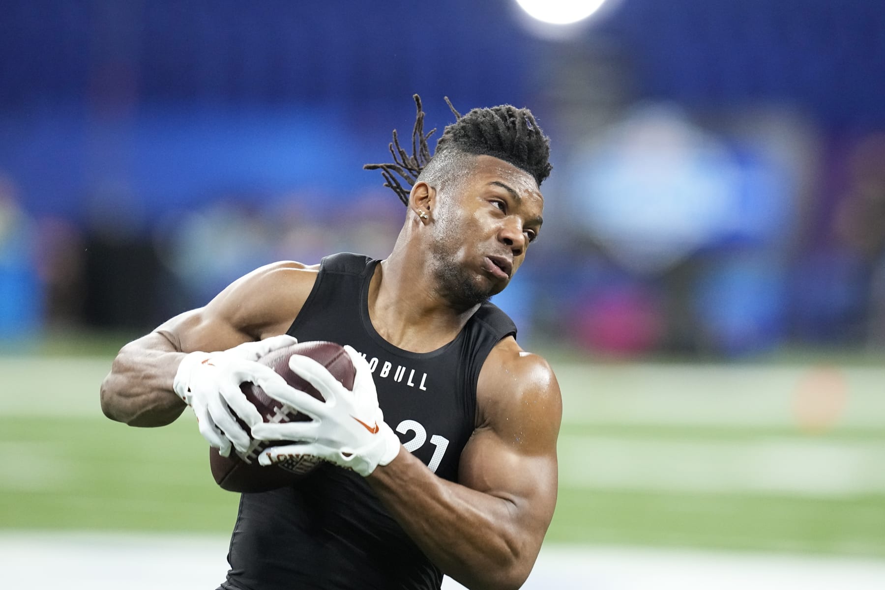 Texas running back Bijan Robinson runs a drill at the NFL football scouting combine in Indianapolis, Sunday, March 5, 2023. (AP Photo/Darron Cummings)