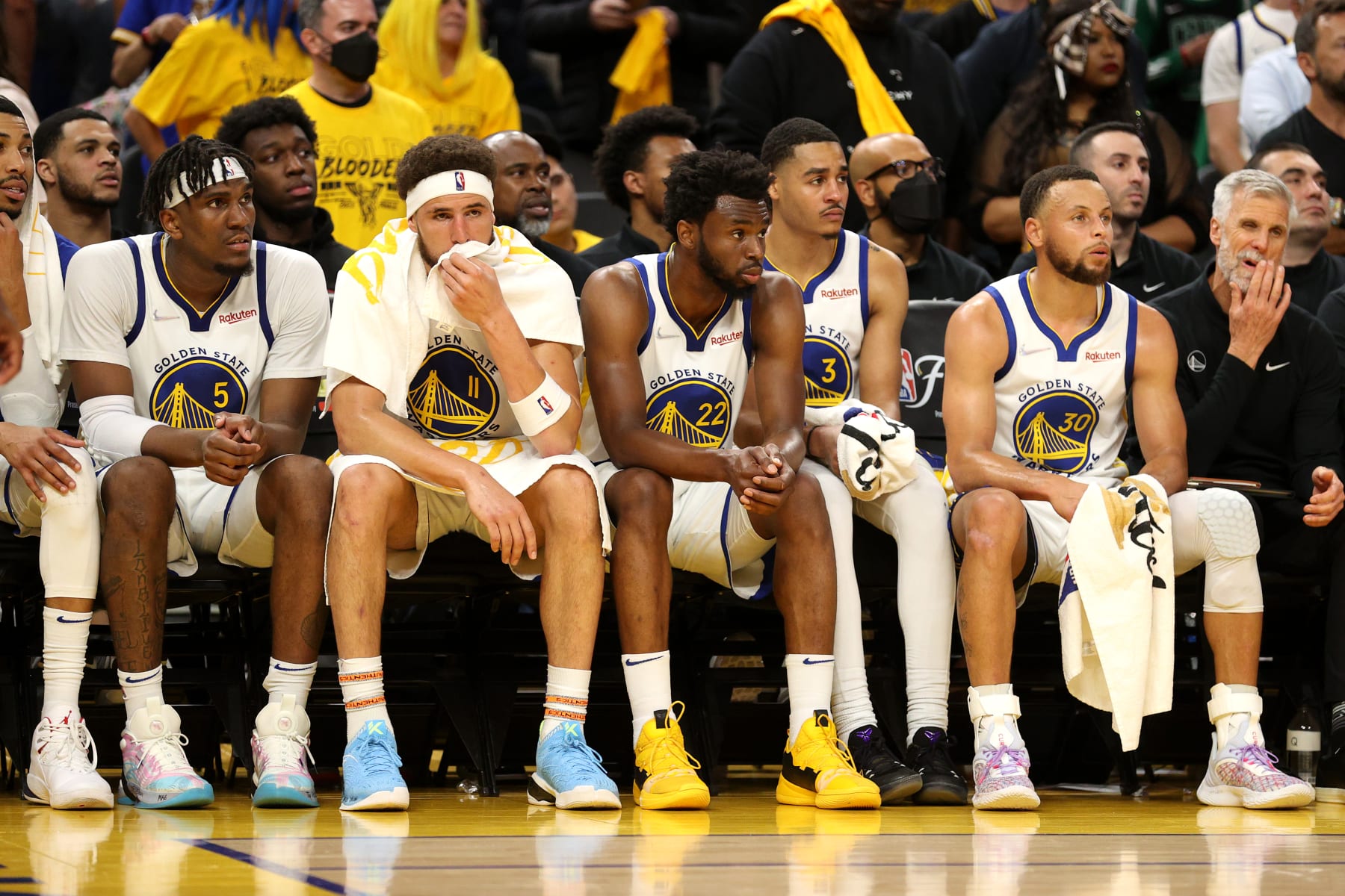 SAN FRANCISCO, CALIFORNIA - JUNE 02: (L to R) Kevon Looney #5, Klay Thompson #11, Andrew Wiggins #22, Jordan Poole #3, and Stephen Curry #30 of the Golden State Warriors look on from the bench during the fourth quarter against the Boston Celtics in Game One of the 2022 NBA Finals at Chase Center on June 02, 2022 in San Francisco, California. NOTE TO USER: User expressly acknowledges and agrees that, by downloading and/or using this photograph, User is consenting to the terms and conditions of the Getty Images License Agreement. (Photo by Ezra Shaw/Getty Images)