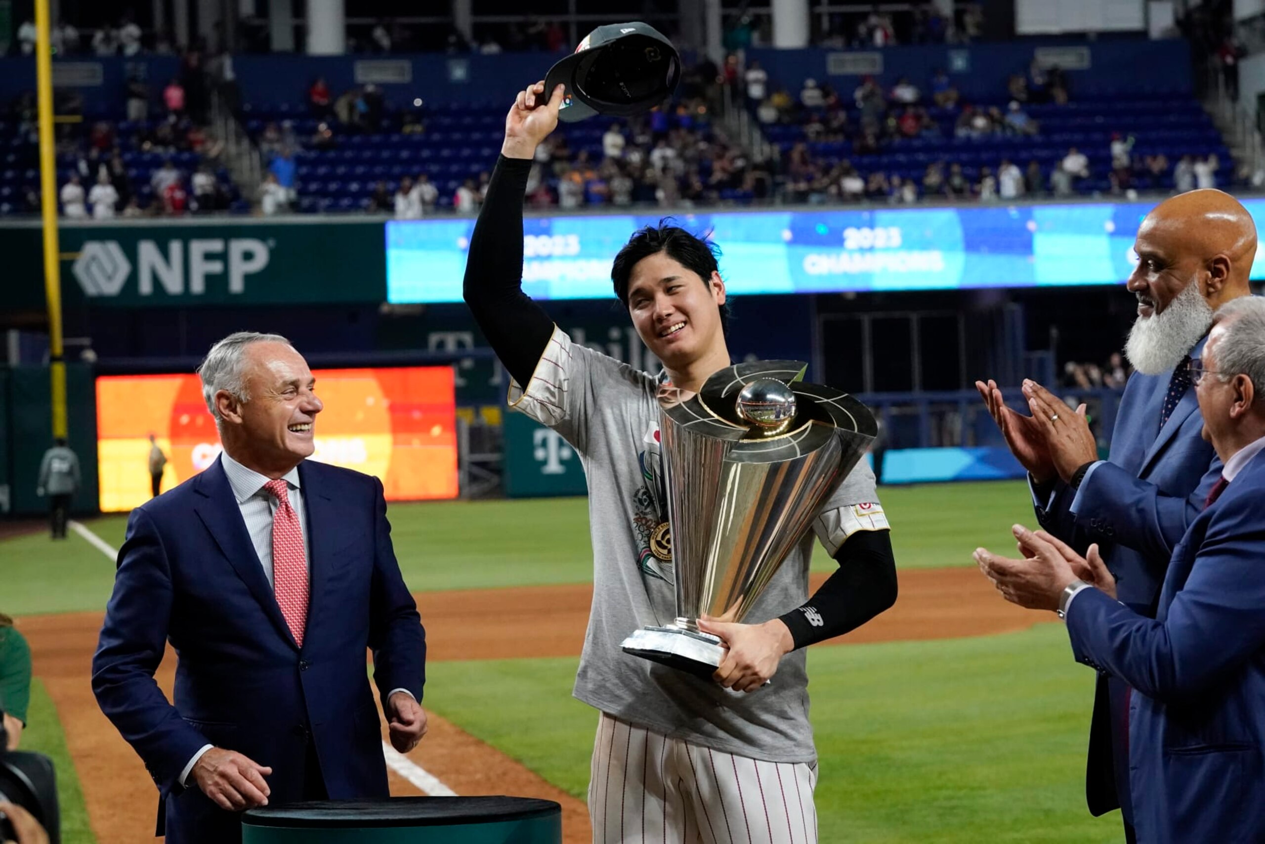 Japan's Shohei Ohtani receives the World Baseball Classic trophy on behalf of the team after defeating the United States in the World Baseball Classic championship game, Tuesday, March 21, 2023, in Miami. (AP Photo/Wilfredo Lee)