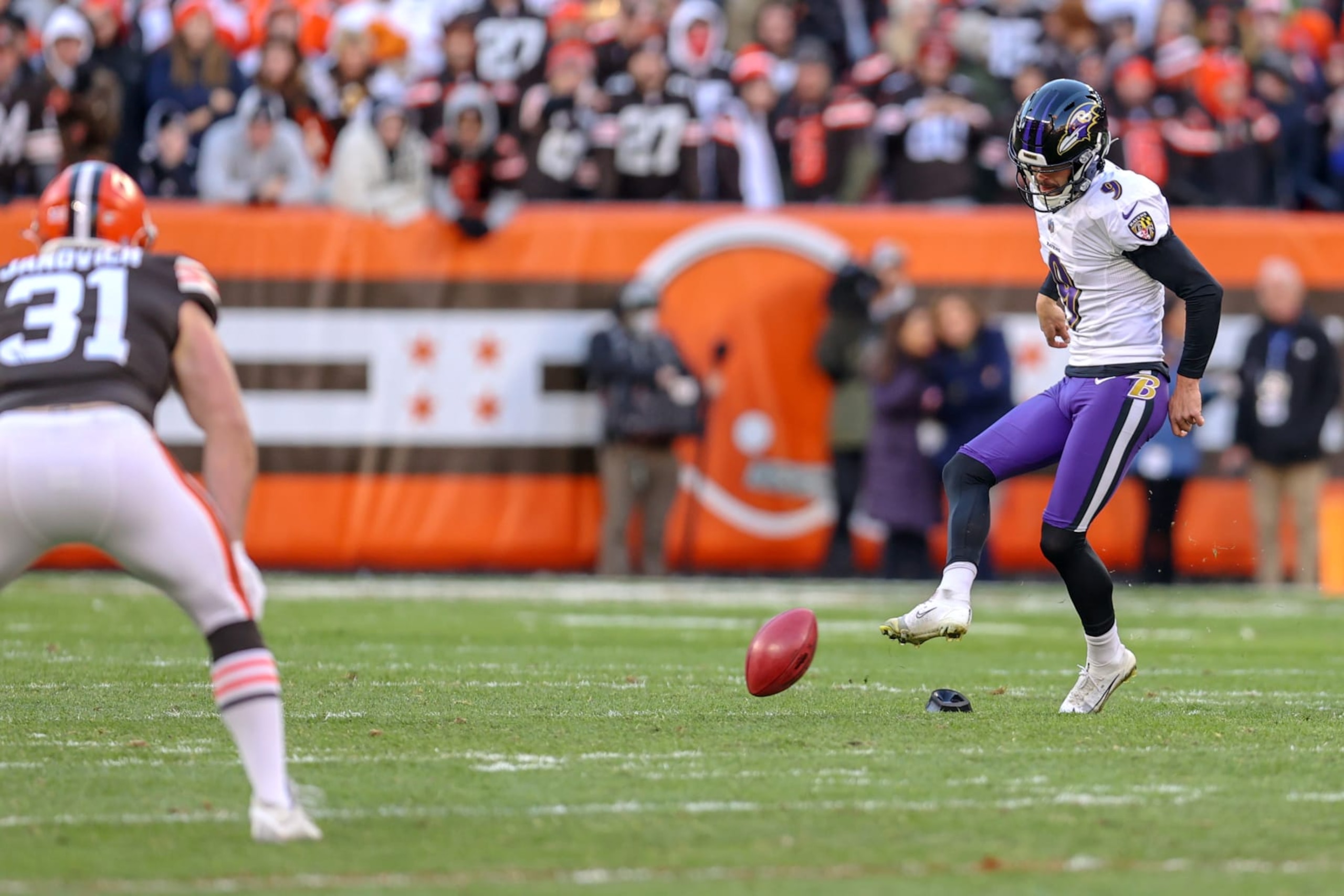CLEVELAND, OH - DECEMBER 12: Baltimore Ravens place kicker Justin Tucker (9) executes an onside kick during the fourth quarter of the National Football League game between the Baltimore Ravens and Cleveland Browns on December 12, 2021, at FirstEnergy Stadium in Cleveland, OH. The ball was touched by Cleveland Browns fullback Andy Janovich (31) and then recovered by Baltimore Ravens safety Chuck Clark (36) (not pictured). (Photo by Frank Jansky/Icon Sportswire via Getty Images)