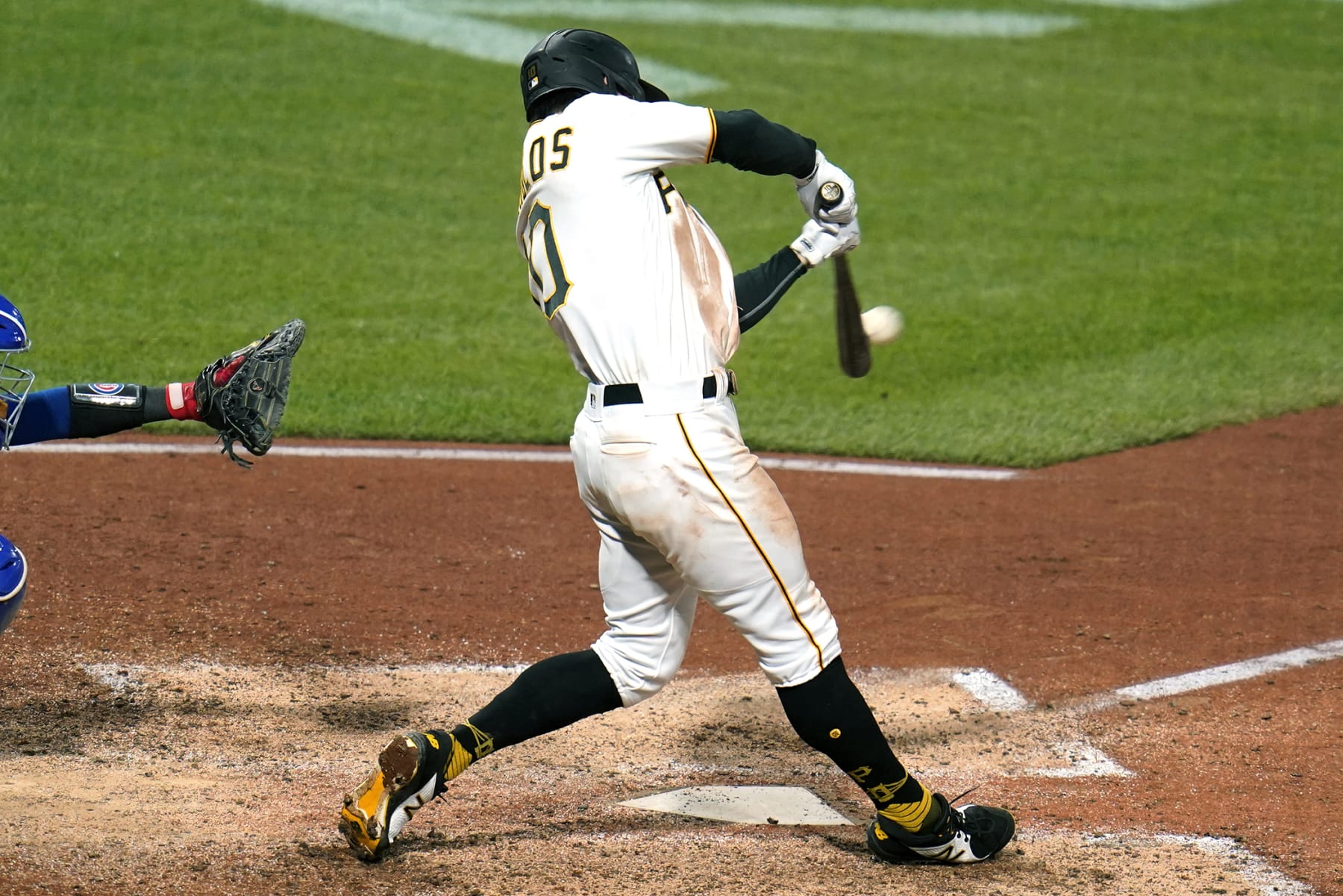 Pittsburgh Pirates' Bryan Reynolds hits a solo home run off Chicago Cubs relief pitcher Manuel Rodriguez during the seventh inning of a baseball game in Pittsburgh, Friday, Sept. 23, 2022. The Cubs won 6-5. (AP Photo/Gene J. Puskar)