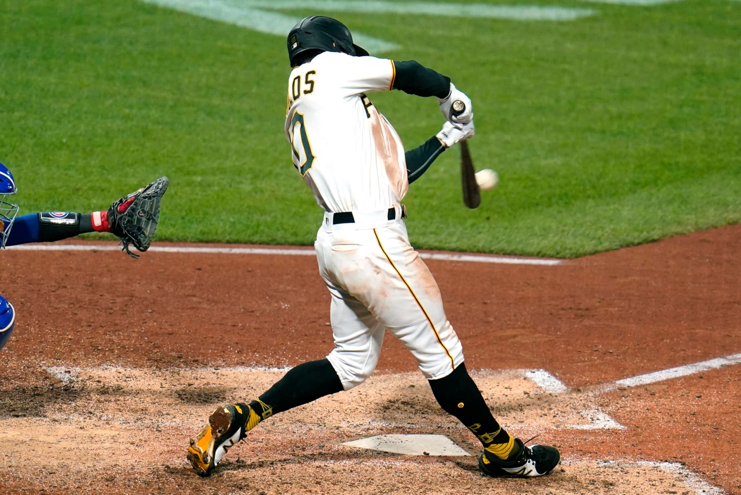 Pittsburgh Pirates' Bryan Reynolds hits a solo home run off Chicago Cubs relief pitcher Manuel Rodriguez during the seventh inning of a baseball game in Pittsburgh, Friday, Sept. 23, 2022. The Cubs won 6-5. (AP Photo/Gene J. Puskar)