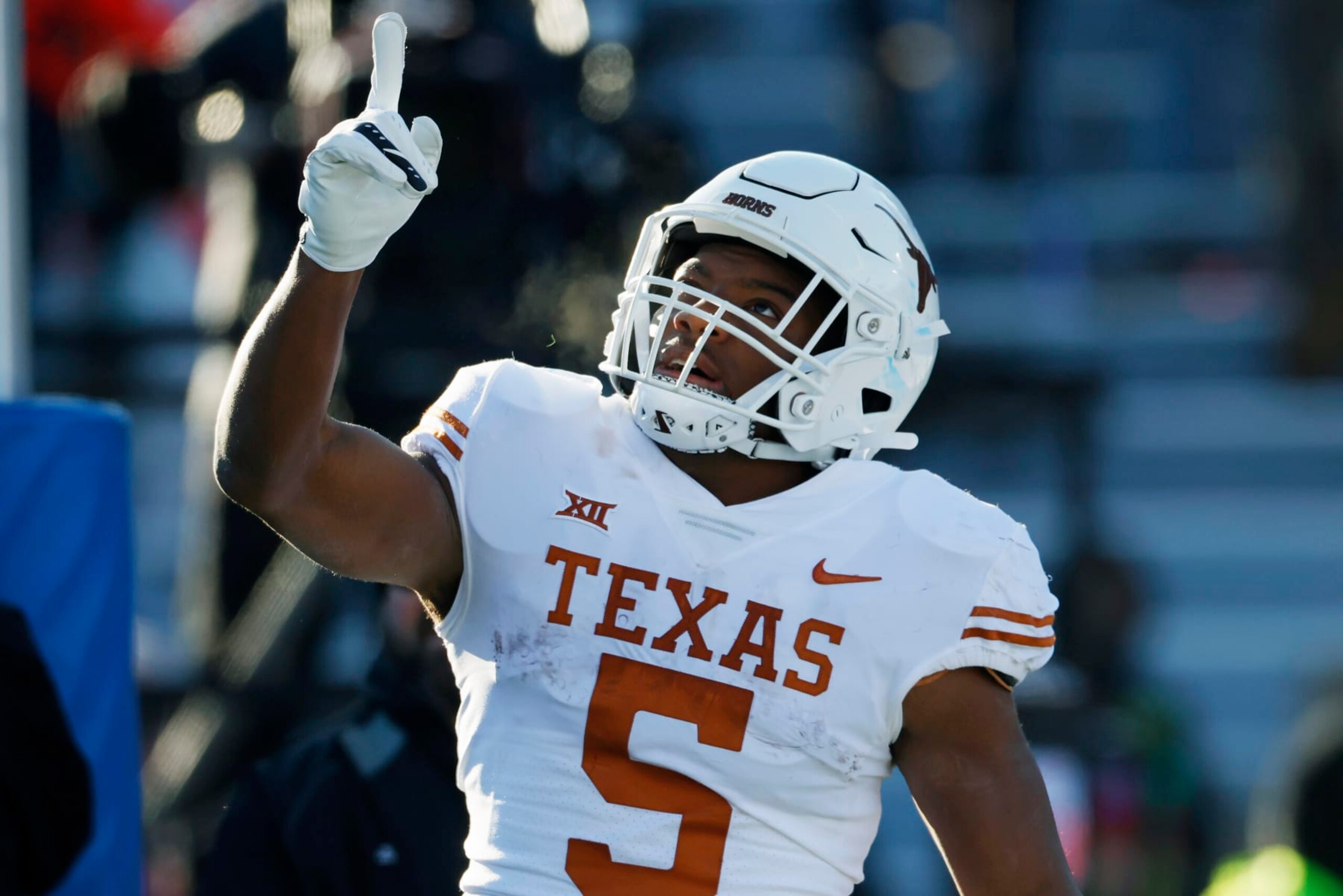 Texas running back Bijan Robinson reacts after scoring against Kansas during the first half of an NCAA college football game on Saturday, Nov. 19, 2022, in Lawrence, Kan. (AP Photo/Colin E. Braley)