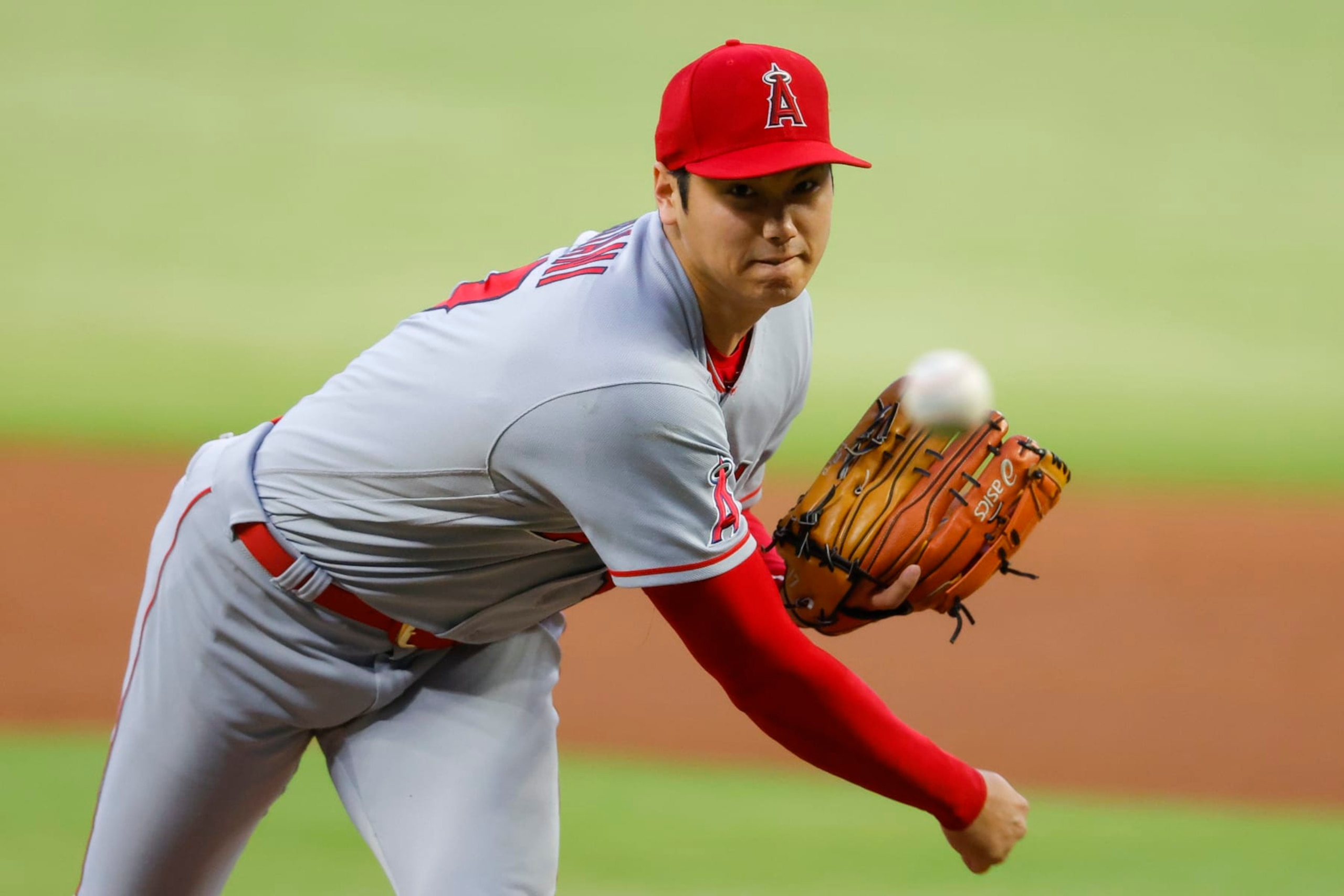 ATLANTA, GA - JULY 22: Shohei Ohtani #17 of the Los Angeles Angels pitches during the first inning against the Atlanta Braves at Truist Park on July 22, 2022 in Atlanta, Georgia. (Photo by Todd Kirkland/Getty Images)