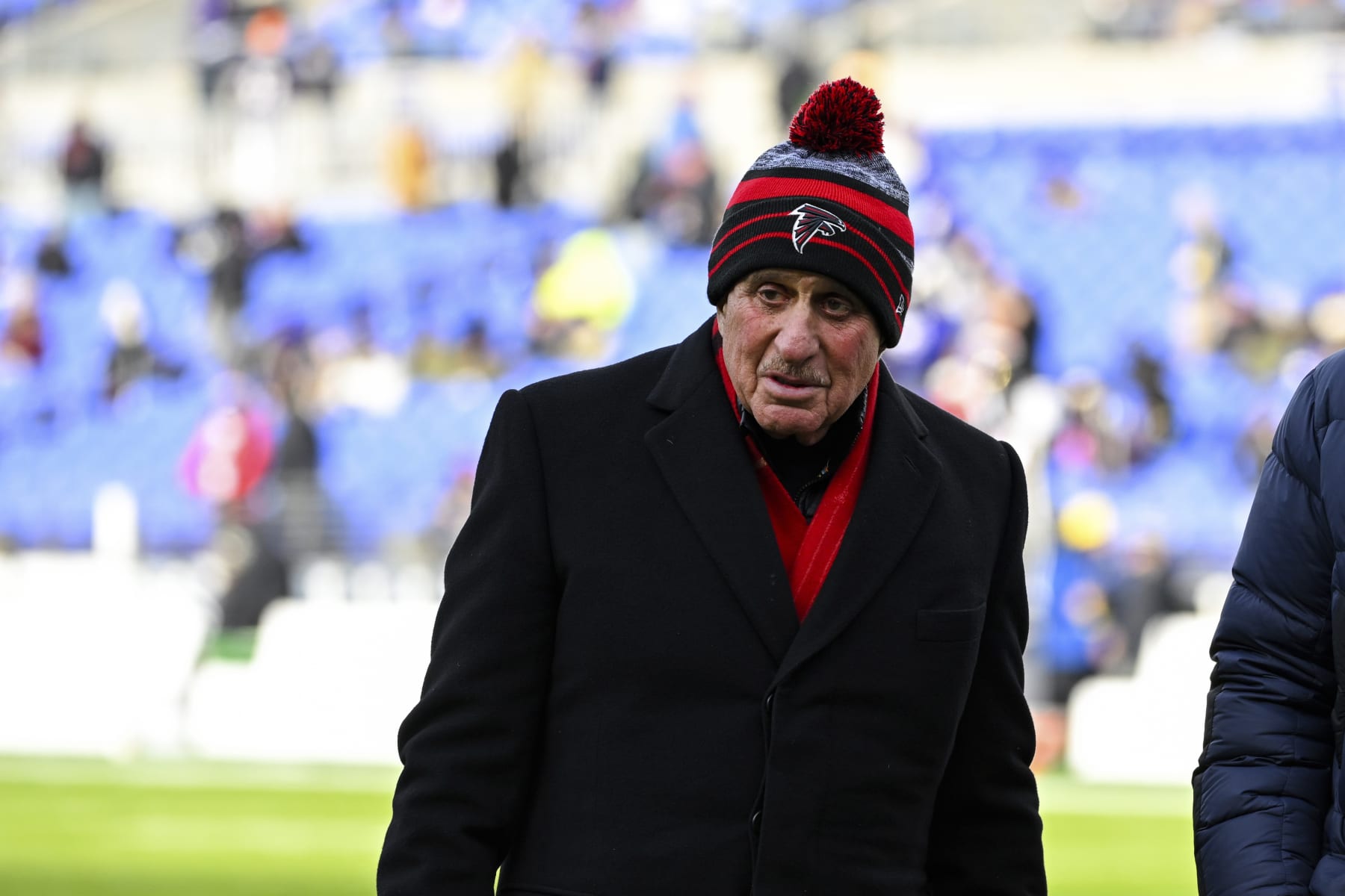 Atlanta Falcons owner Arthur Blank walks on the field during pre-game warm-ups before an NFL football game against the Baltimore Ravens, Saturday, Dec. 24, 2022, in Baltimore. (AP Photo/Terrance Williams)