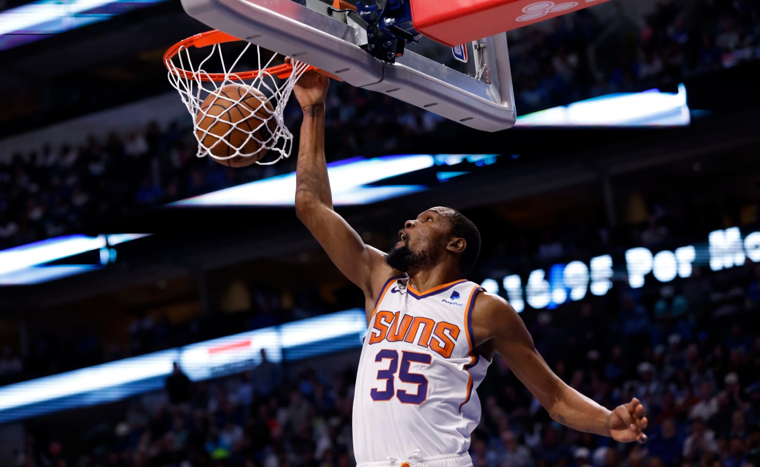 DALLAS, TX - MARCH 5: Kevin Durant #35 of the Phoenix Suns slam dunks against the Dallas Mavericks in the second half at American Airlines Center on March 5, 2023 in Dallas, Texas. The Suns won 130-126. NOTE TO USER: User expressly acknowledges and agrees that, by downloading and or using this photograph, User is consenting to the terms and conditions of the Getty Images License Agreement. (Photo by Ron Jenkins/Getty Images)