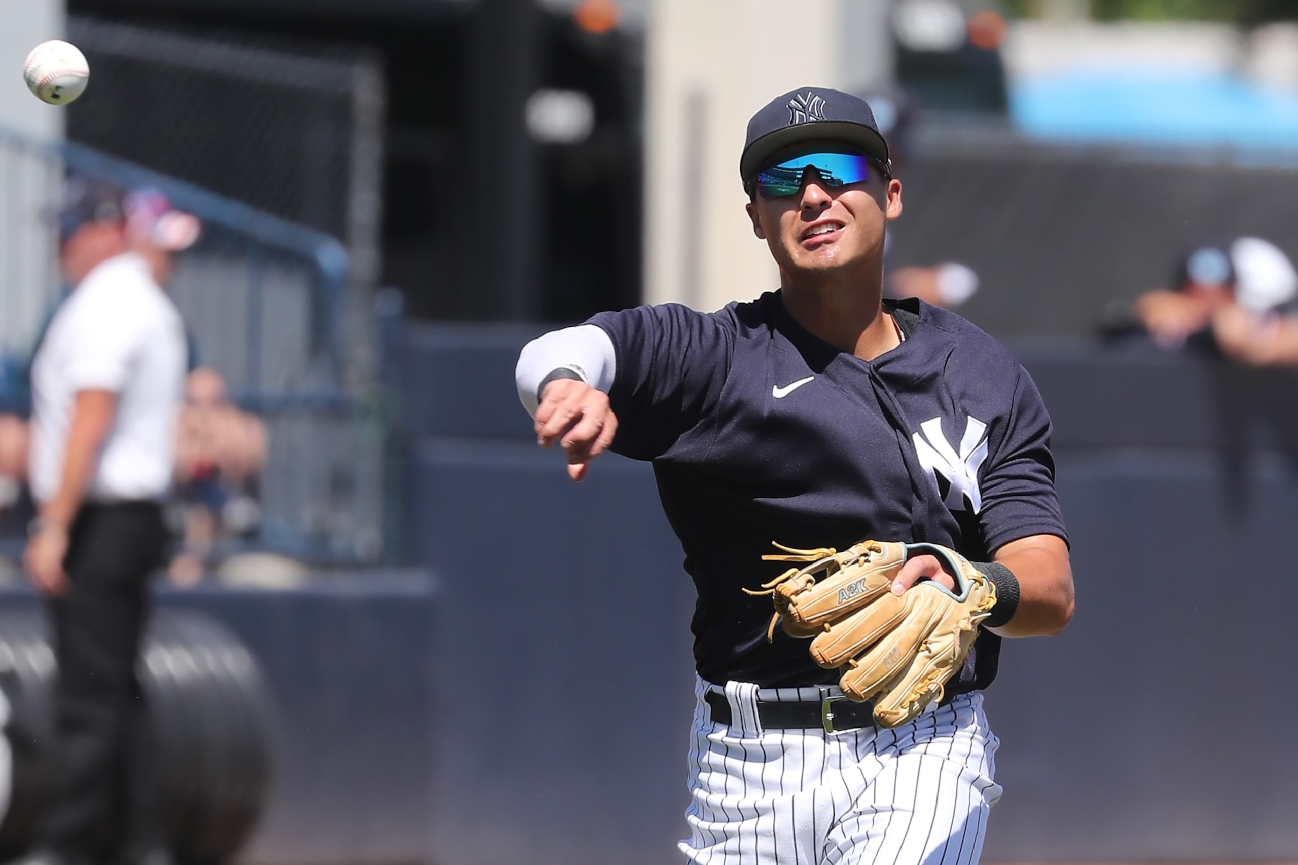 TAMPA, FL - MARCH 24: New York Yankees Infielder Anthony Volpe (77) throws the ball over to first base during the spring training game between the Minnesota Twins and the New York Yankees on March 24, 2023 at George M. Steinbrenner Field in Tampa, FL. (Photo by Cliff Welch/Icon Sportswire via Getty Images)