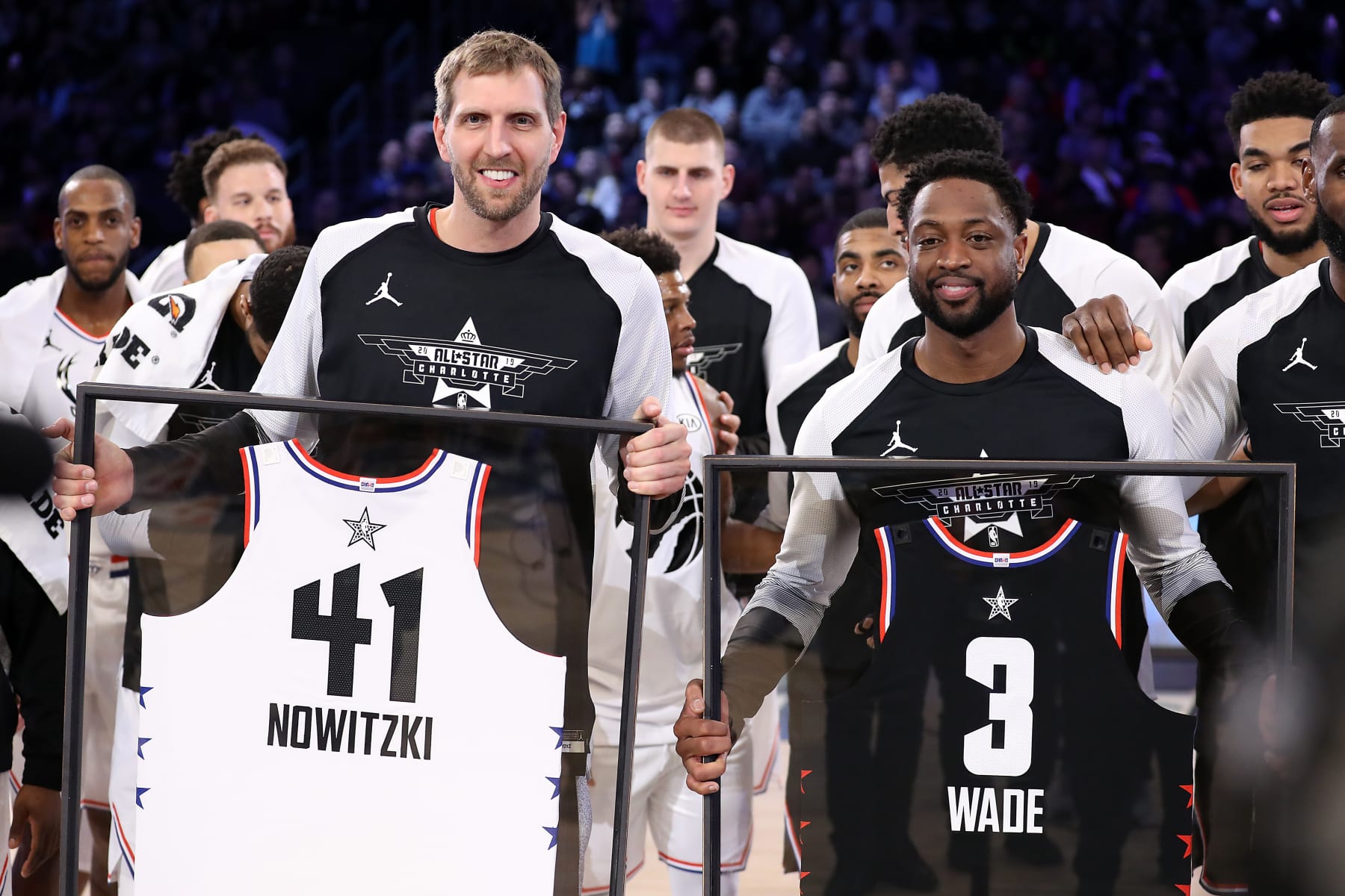 CHARLOTTE, NORTH CAROLINA - FEBRUARY 17:  Dirk Nowitzki #41 of Team Giannis and Dwyane Wade #3 of Team LeBron receive commemorative All-Star jerseys after the NBA All-Star game as part of the 2019 NBA All-Star Weekend at Spectrum Center on February 17, 2019 in Charlotte, North Carolina. Team LeBron won 178-164. NOTE TO USER: User expressly acknowledges and agrees that, by downloading and/or using this photograph, user is consenting to the terms and conditions of the Getty Images License Agreement. (Photo by Streeter Lecka/Getty Images)